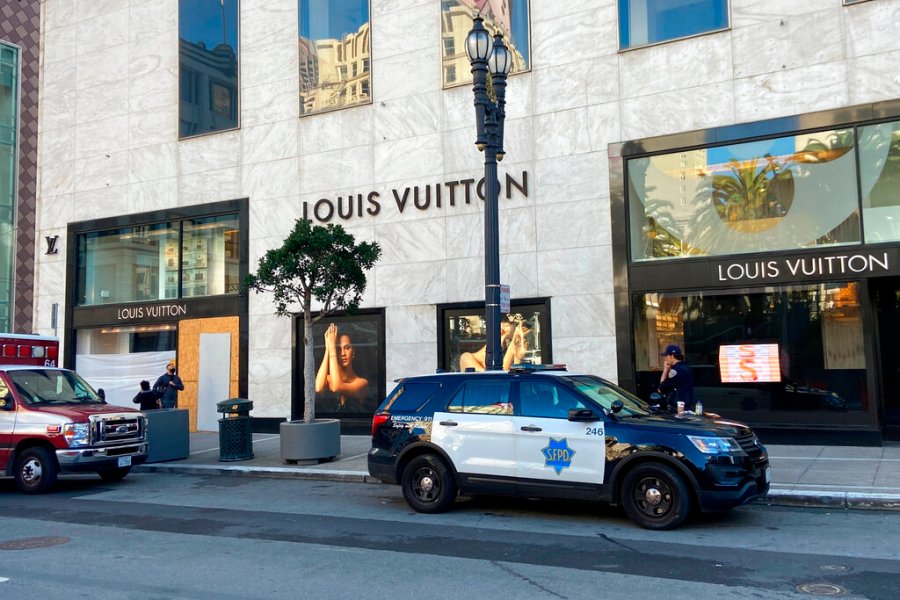 Police officers and emergency crews park outside the Louis Vuitton store in San Francisco's Union Square on Nov. 21, 2021, after looters ransacked businesses. (Danielle Echeverria/San Francisco Chronicle via AP, File)