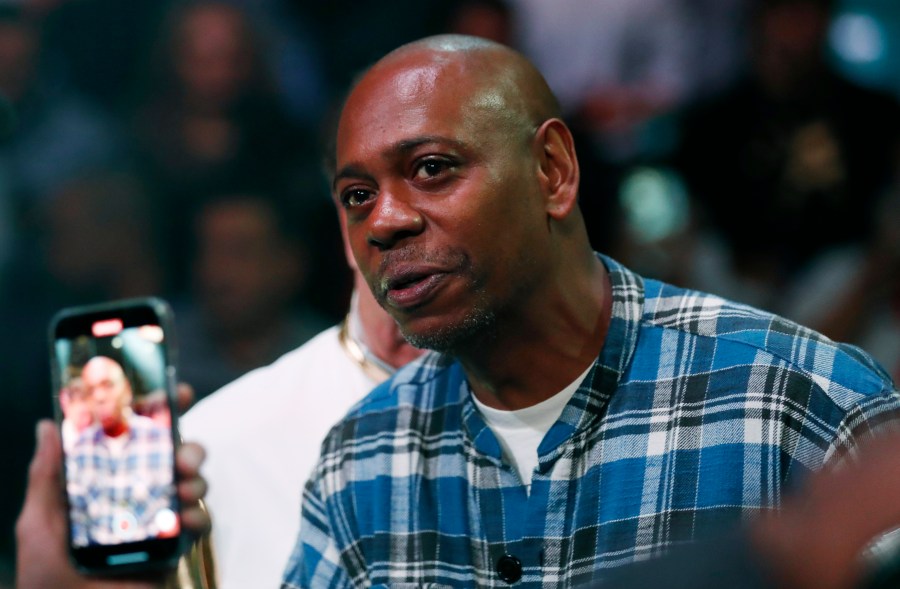 Comedian Dave Chappelle attends a boxing bout Nov. 6, 2021, in Las Vegas. Two former Netflix employees who raised concerns about anti-transgender comments on Dave Chappelle’s TV special are dropping labor complaints and one has resigned from the company. Terra Field, a senior software engineer who is trans, announced a voluntary resignation on Monday, Nov. 22. Field and B. Pagels-Minor also are dropping a National Labor Relations Board complaint that claimed retaliation. (AP Photo/Steve Marcus, File)