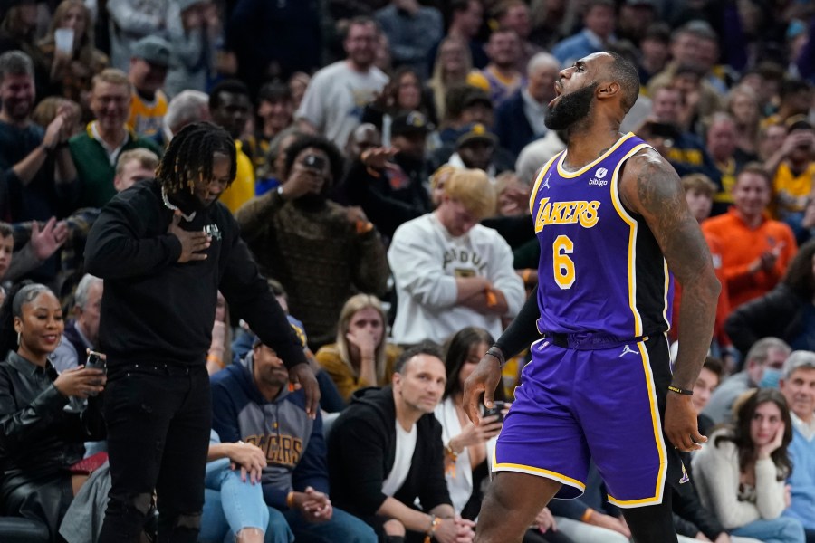 Los Angeles Lakers' LeBron James reacts after hitting a shot during overtime of in the team's NBA basketball game against the Indiana Pacers on Nov. 24, 2021, in Indianapolis. (AP Photo/Darron Cummings)