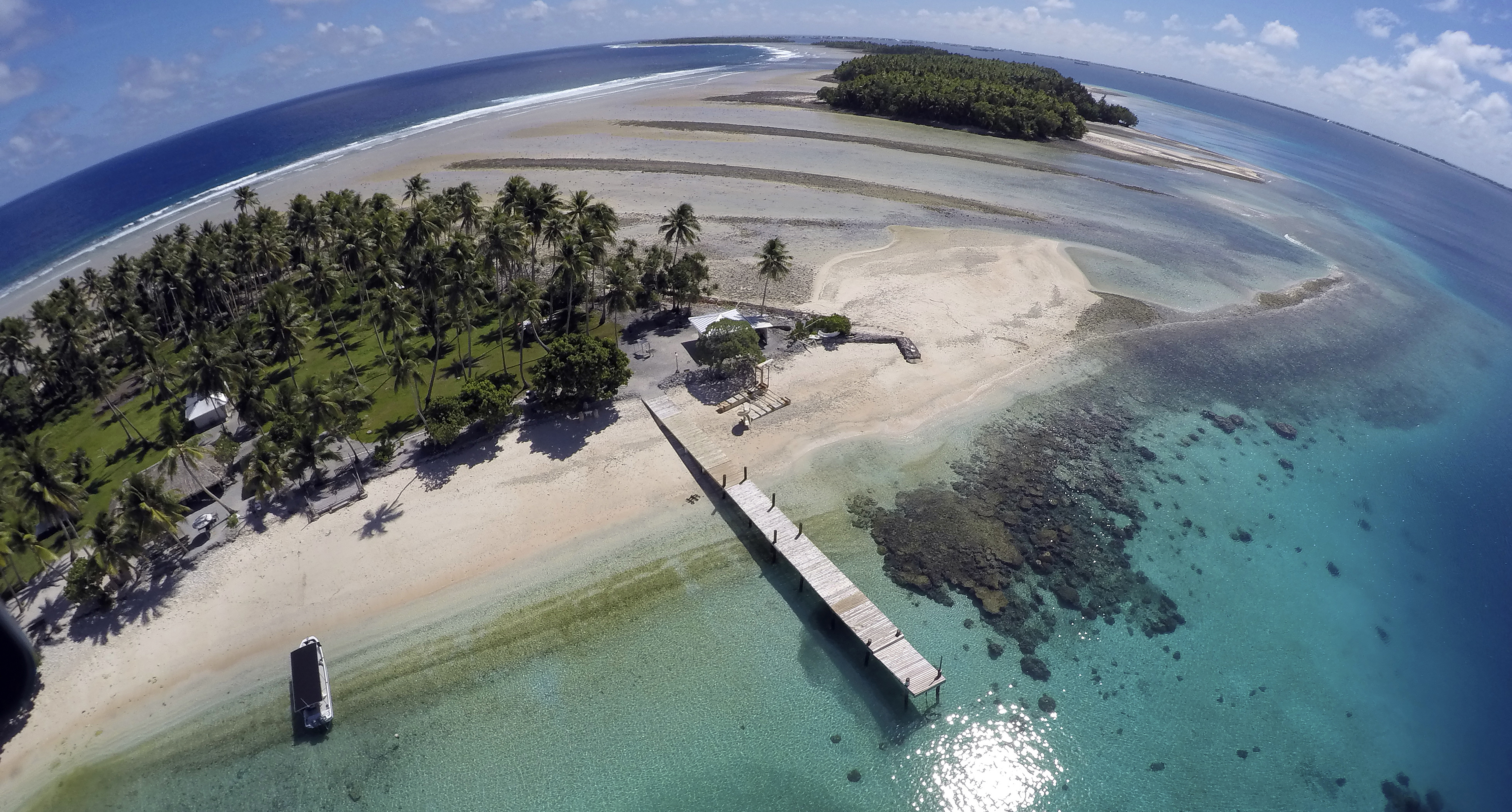 An aerial photo shows a small section of the atoll that has slipped beneath the water line only showing a small pile of rocks at low tide on Majuro Atoll in the Marshall Islands on Nov. 8, 2015. (AP Photo/Rob Griffith, File)