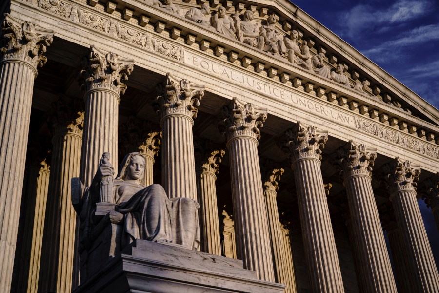 The Supreme Court is seen at dusk in Washington, Oct. 22, 2021. Both sides are telling the Supreme Court there’s no middle ground in Wednesday’s showdown over abortion. (AP Photo/J. Scott Applewhite, File)