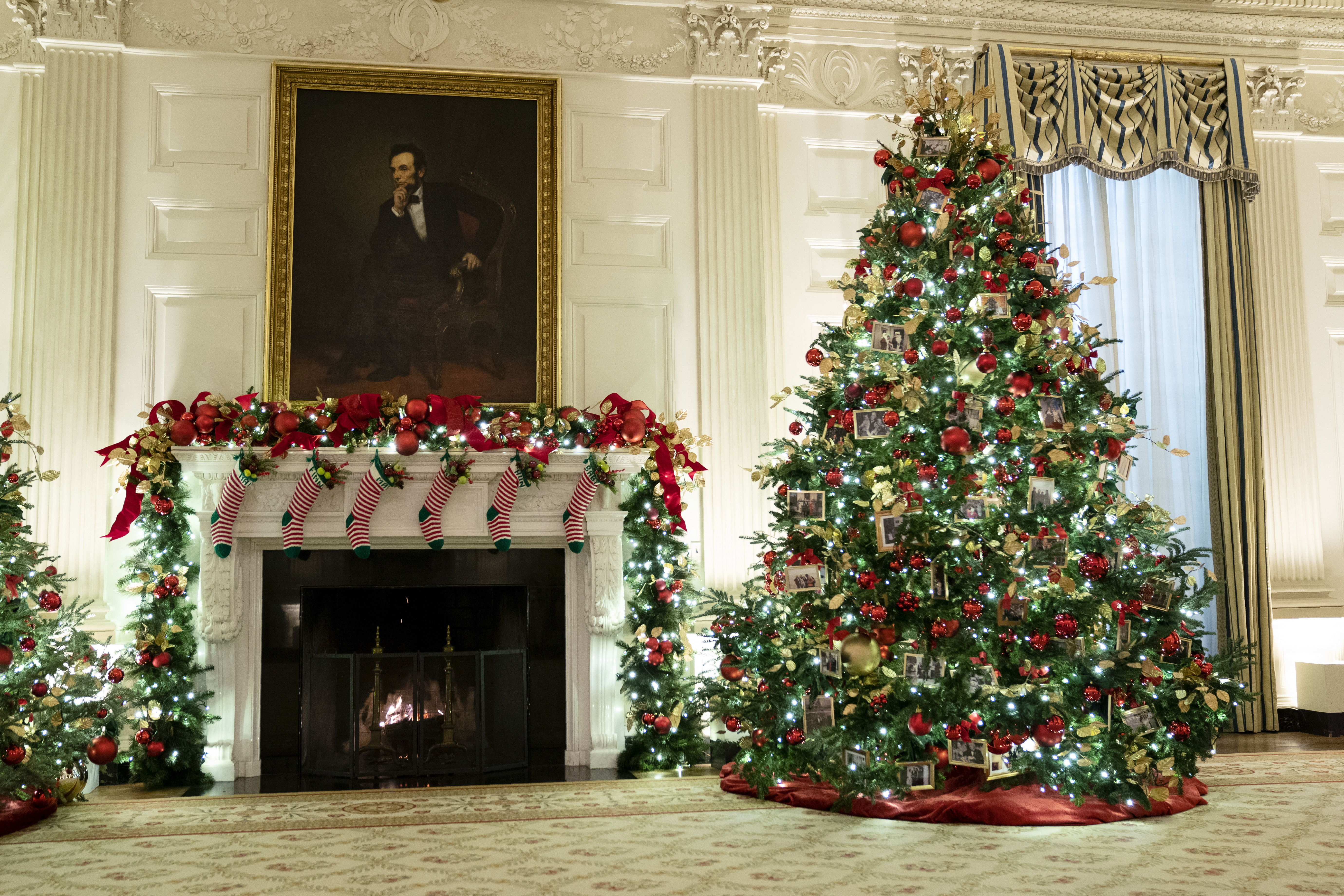 The East Room of the White House is decorated for the holiday season during a press preview of the White House holiday decorations, Monday, Nov. 29, 2021, in Washington. (AP Photo/Evan Vucci)