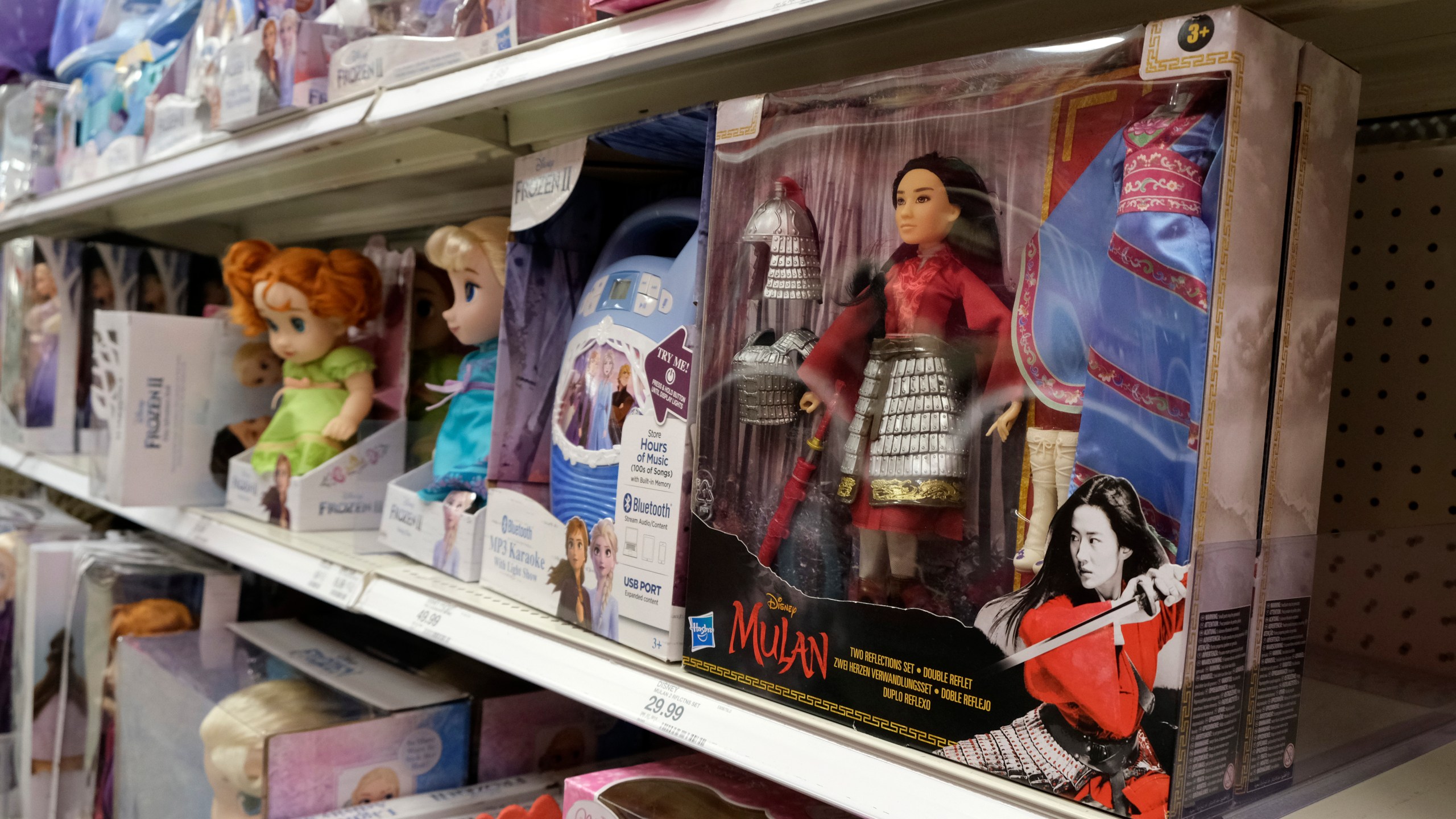 A doll based on the upcoming Walt Disney Studios film "Mulan" is displayed in the toy section of a Target department store, April 30, 2020, in Glendale, Calif. As supply chain bottlenecks create shortages on many items, some charities are struggling to secure holiday gift wishes from kids in need. They're reporting they can't find enough items in stock, or are facing shipping delays both in receiving and distributing the gifts. The founder of the organization One Simple Wish says many gift requests for gaming consoles and electronic items submitted to the charity have been out of stock. (AP Photo/Chris Pizzello, file)