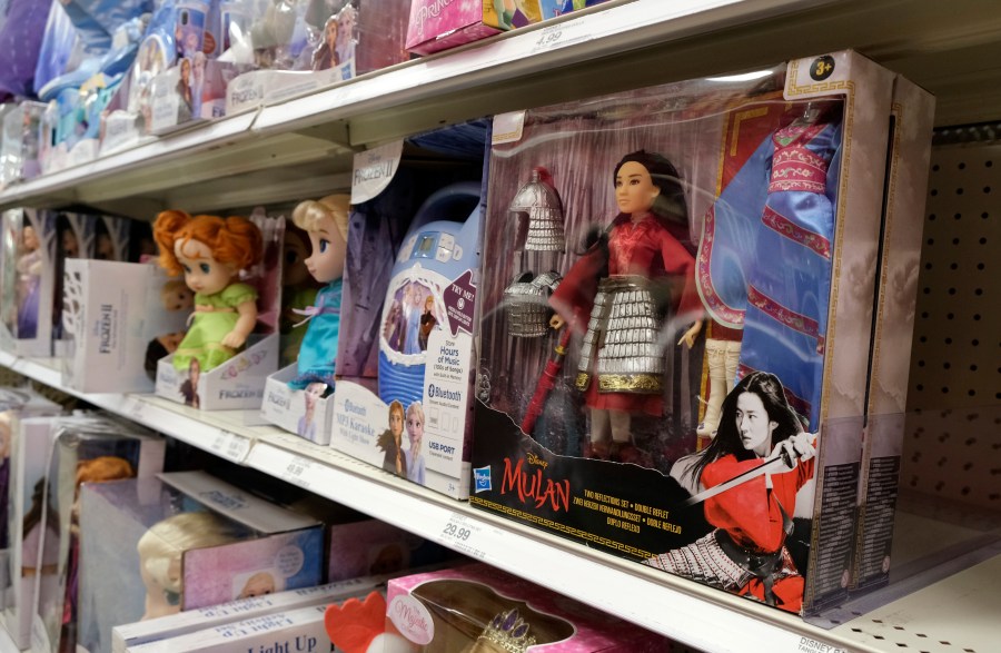 A doll based on the upcoming Walt Disney Studios film "Mulan" is displayed in the toy section of a Target department store, April 30, 2020, in Glendale, Calif. As supply chain bottlenecks create shortages on many items, some charities are struggling to secure holiday gift wishes from kids in need. They're reporting they can't find enough items in stock, or are facing shipping delays both in receiving and distributing the gifts. The founder of the organization One Simple Wish says many gift requests for gaming consoles and electronic items submitted to the charity have been out of stock. (AP Photo/Chris Pizzello, file)