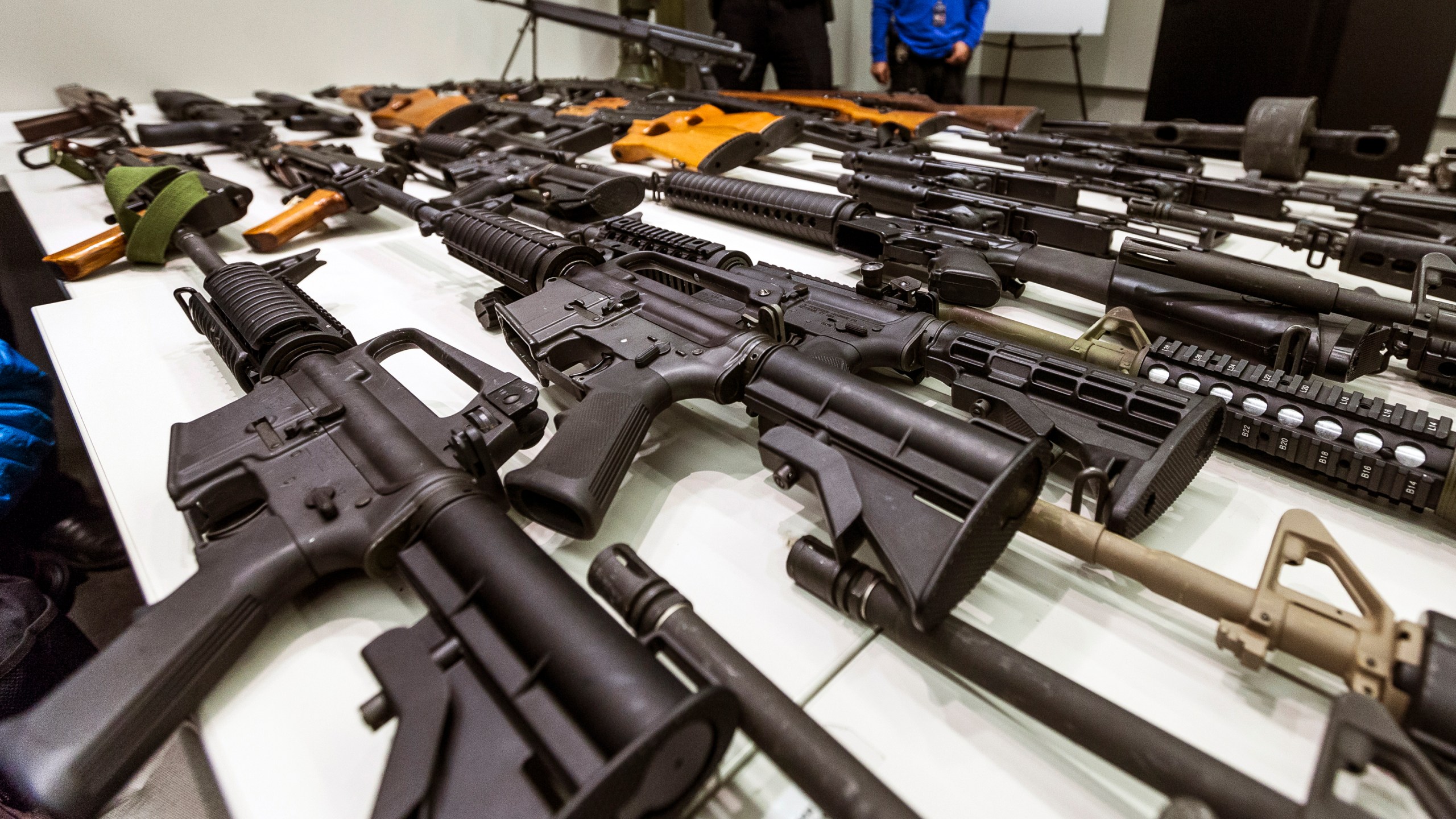 In this Dec. 27, 2012, file photo, a variety of military-style semi-automatic rifles obtained during a buy back program are displayed at Los Angeles police headquarters. The 9th U.S. Circuit Court of Appeals overturned two lower court judges and upheld California’s ban on high-capacity magazines Nov. 30, 2021, in a split decision that may be headed for the U.S. Supreme Court. (Damian Dovarganes/Associated Press)