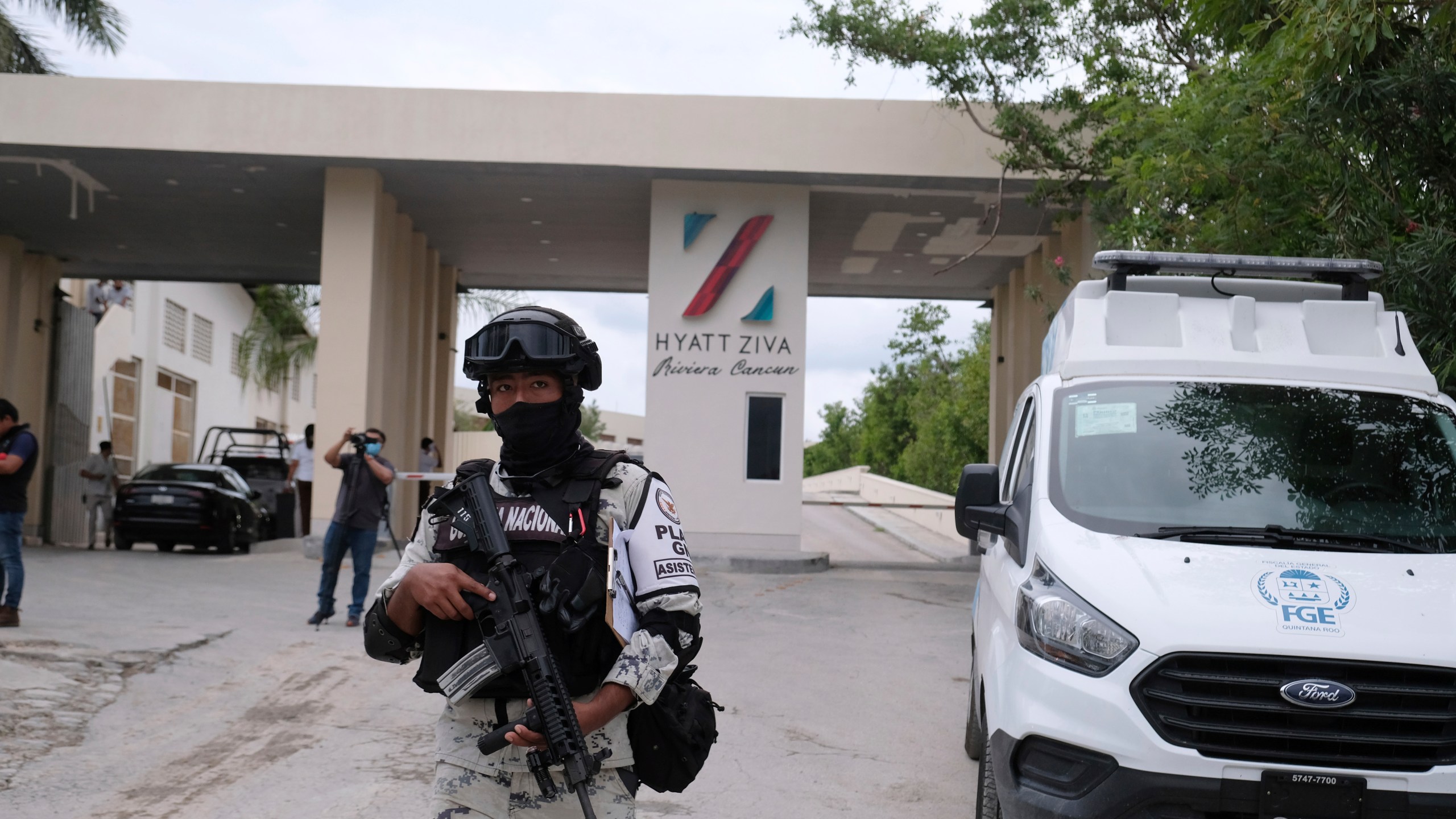 Government forces guard the entrance of hotel after an armed confrontation near Puerto Morelos, Mexico, Thursday, Nov. 4, 2021. Two suspected drug dealers were killed after gunmen from competing gangs staged a dramatic shootout near upscale hotels that sent foreign tourists scrambling for cover. (AP Photo/Karim Torres)