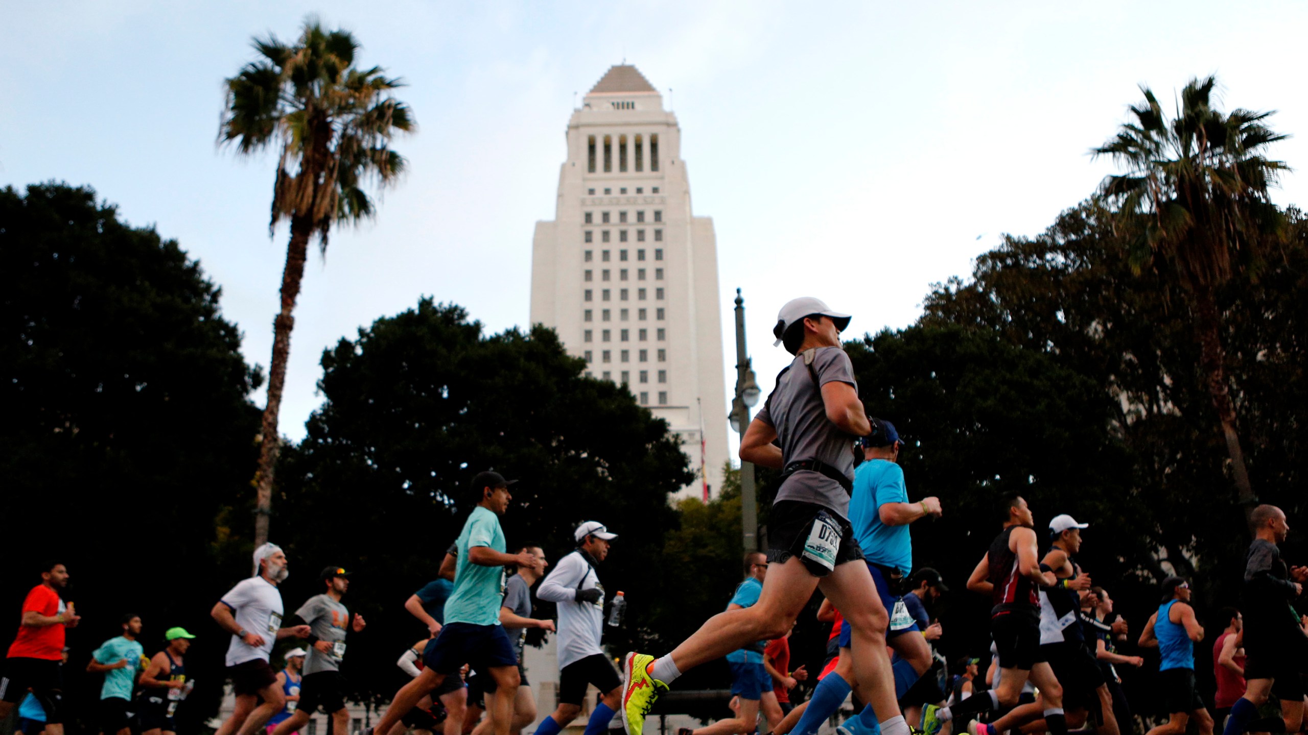 Runners make their way down 1st Street near City Hall during the 2020 Los Angeles Marathon on March 8, 2020 in Los Angeles. (Katharine Lotze/Getty Images)