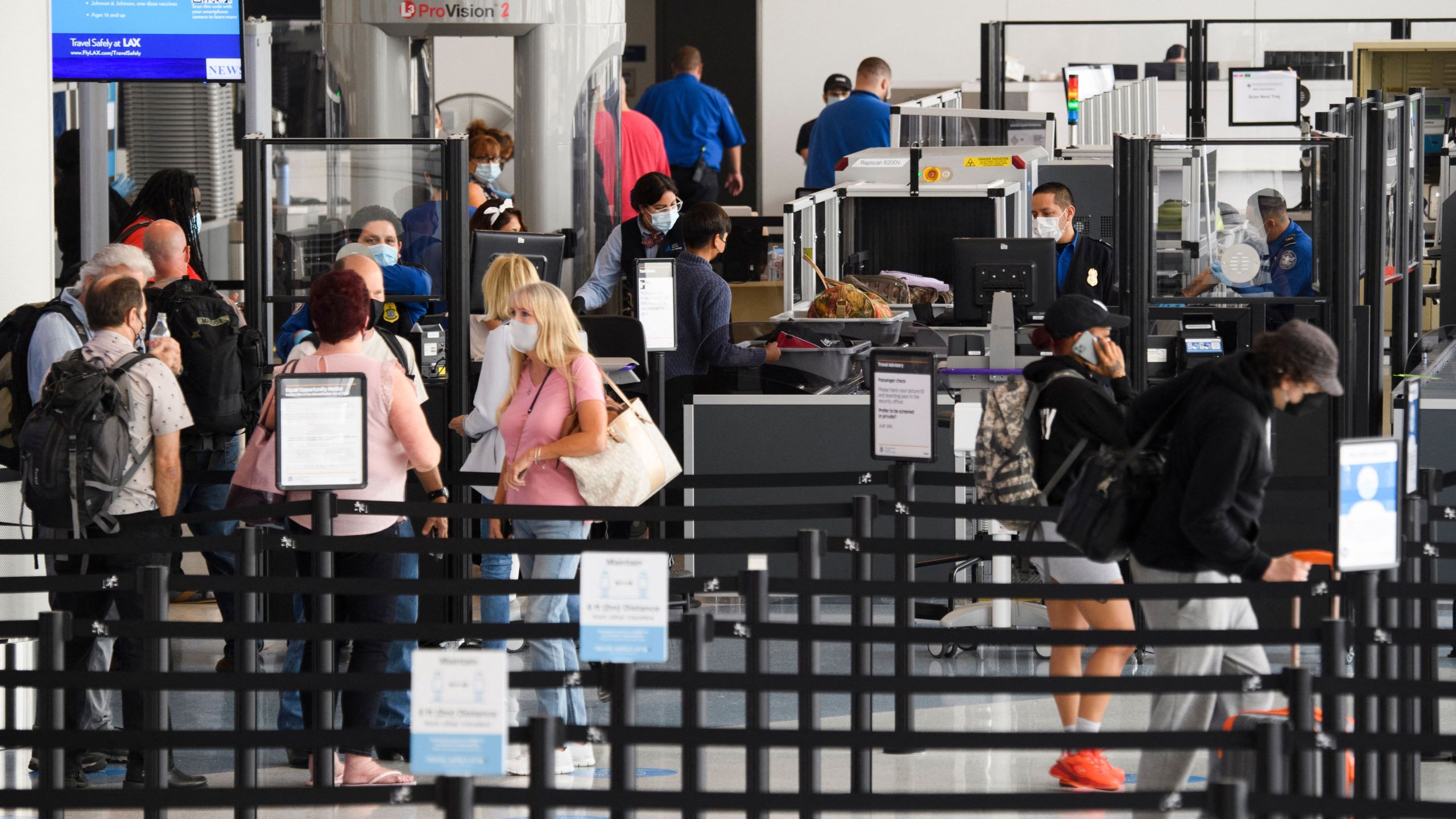 Travelers enter a new TSA screening area during the opening of the Terminal 1 expansion at Los Angeles International Airport on June 4, 2021 in Los Angeles, (PATRICK T. FALLON/AFP via Getty Images)