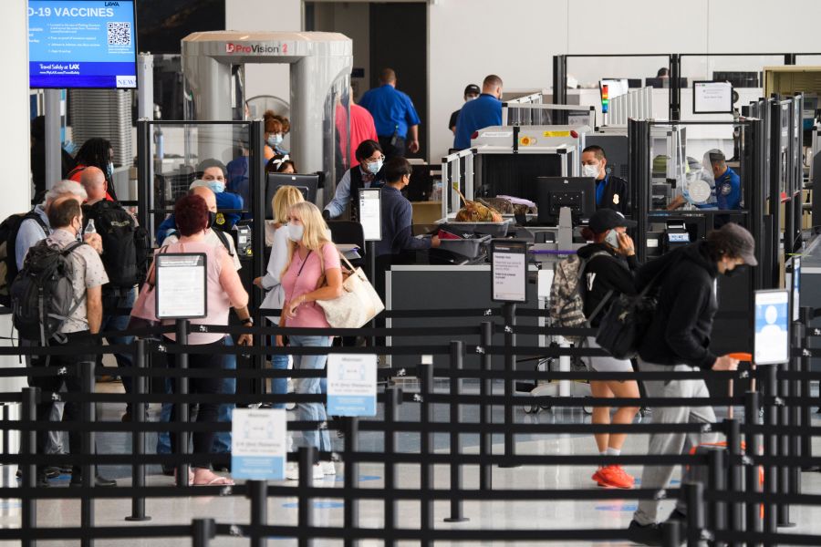 Travelers enter a new TSA screening area during the opening of the Terminal 1 expansion at Los Angeles International Airport on June 4, 2021 in Los Angeles, (PATRICK T. FALLON/AFP via Getty Images)