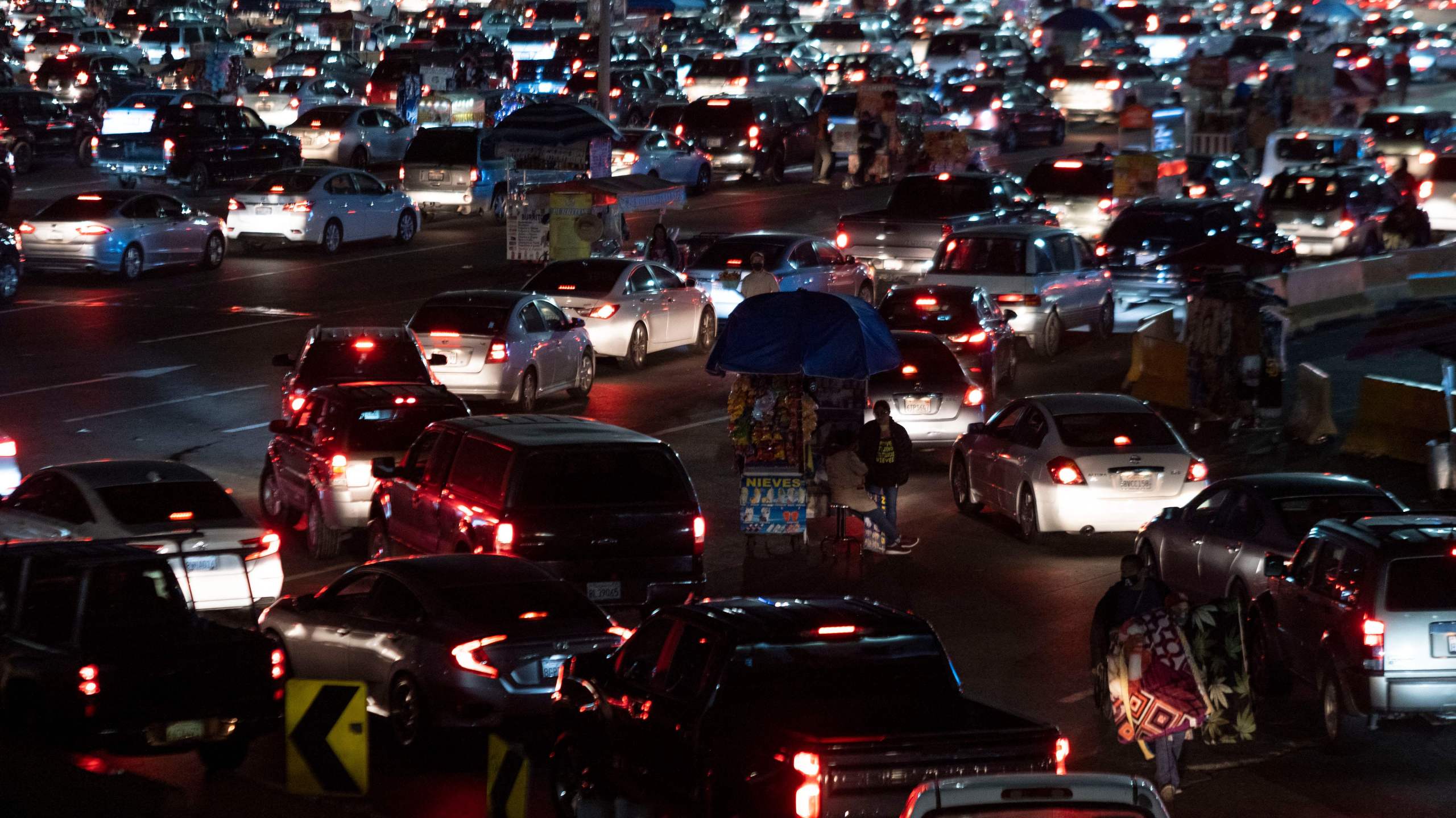 Cars queue to cross the border at San Ysidro crossing port on the Mexico-United States border in Tijuana, Baja California state, Mexico, on November 7, 2021.. (GUILLERMO ARIAS/AFP via Getty Images)