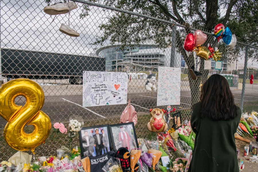 A woman views a memorial dedicated to those who died at the Astroworld festival outside of NRG Park on Nov. 9, 2021 in Houston. (Brandon Bell/Getty Images)