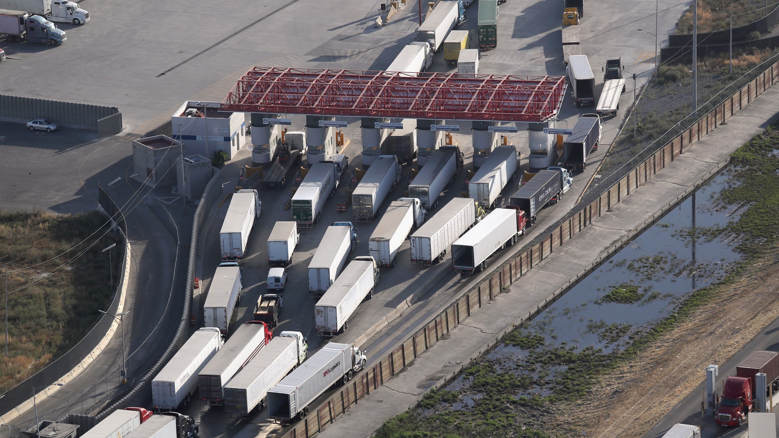 Freight trucks, as seen from a helicopter, pass through Mexican Customs before entering the United States at the Otay Mesa port of entry on May 11, 2017 in San Diego. (John Moore/Getty Images)