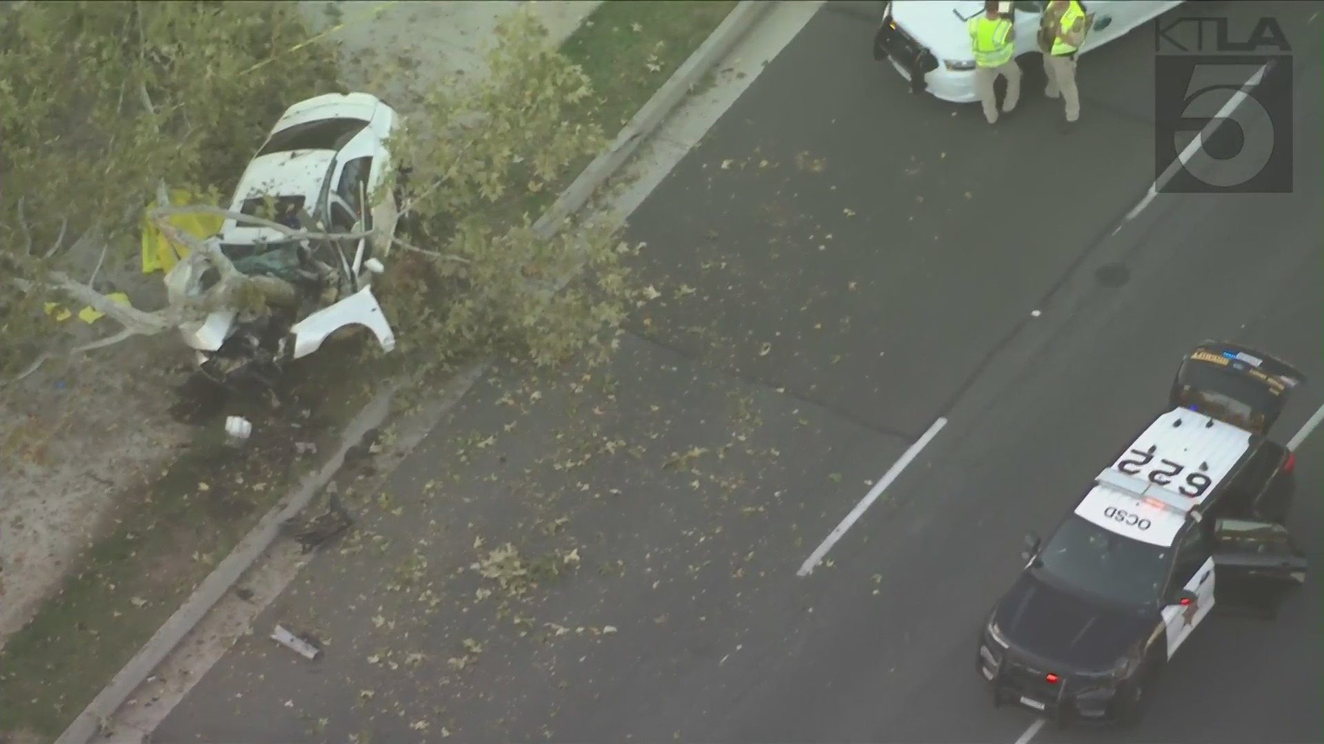 One person died and another was taken to a nearby hospital after a car crashed into a tree in Lake Forest on Nov. 2, 2021. (KTLA)