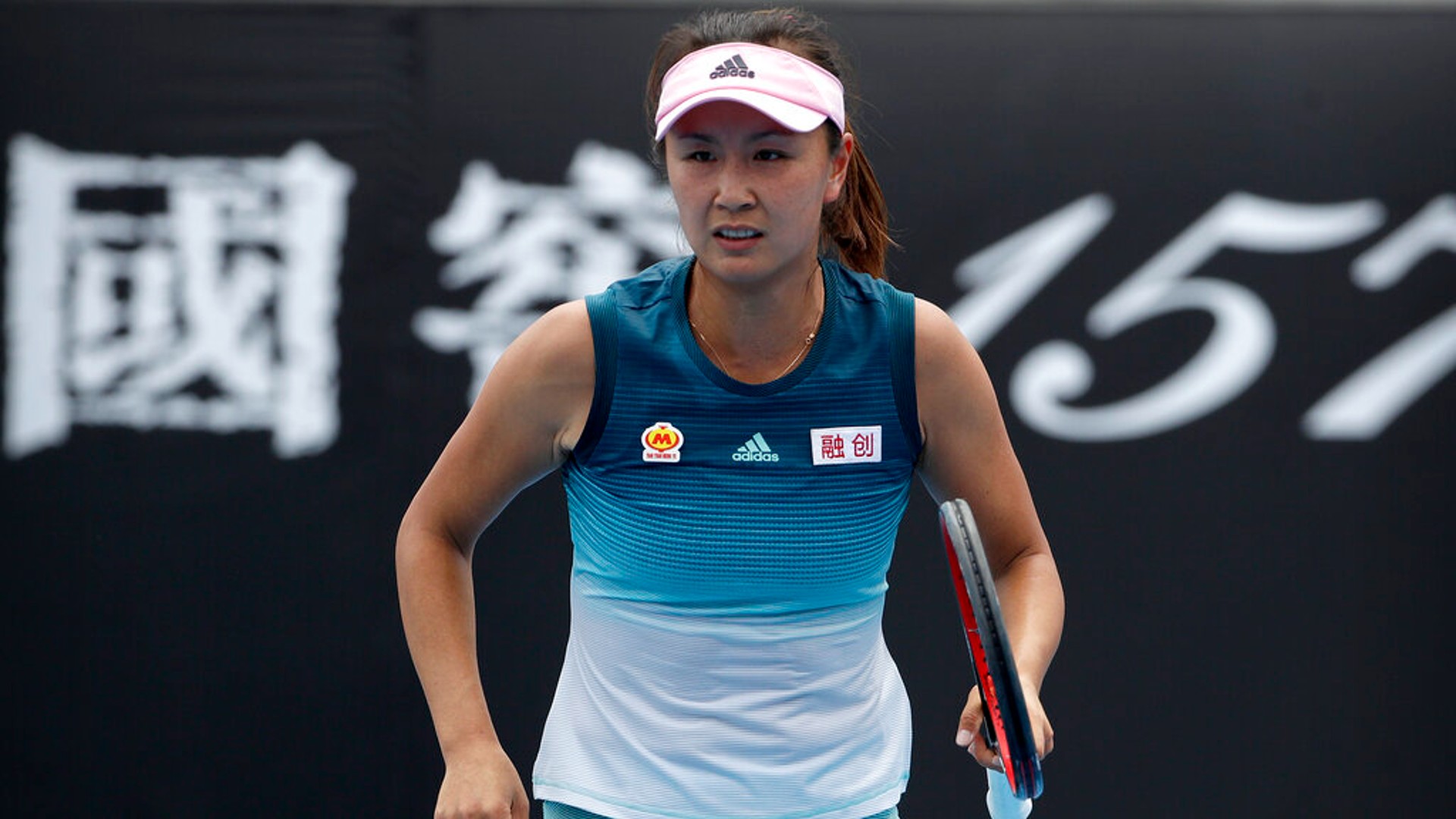 China's Peng Shuai reacts while competing against Canada's Eugenie Bouchard in their first round match at the Australian Open tennis championships in Melbourne, Australia, Tuesday, Jan. 15, 2019. (AP Photo/Mark Schiefelbein)