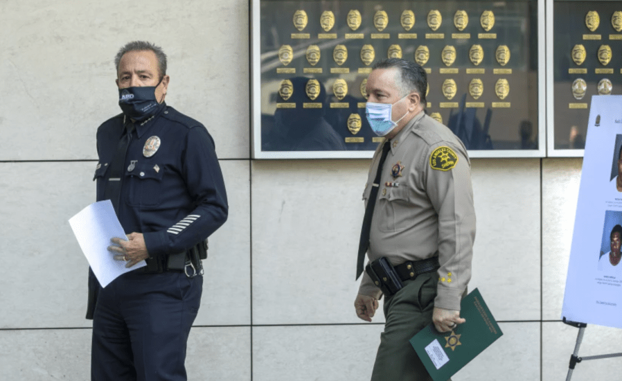 LAPD Chief Michel Moore, left, with Los Angeles County Sheriff Alex Villanueva. (Mel Melcon/Los Angeles Times)