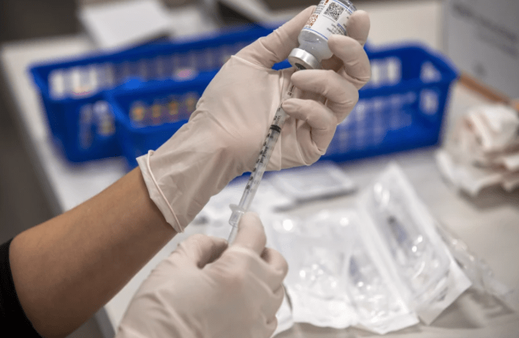 A dose of the Moderna COVID-19 vaccine is prepared during a clinic in El Monte on Nov. 17.(Francine Orr / Los Angeles Times)