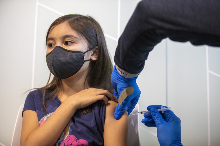 Kailyn Nguyen, 9, gets a COVID-19 vaccination at Kaiser Permanente Tustin Ranch on Nov. 4, 2021.(Francine Orr / Los Angeles Times)