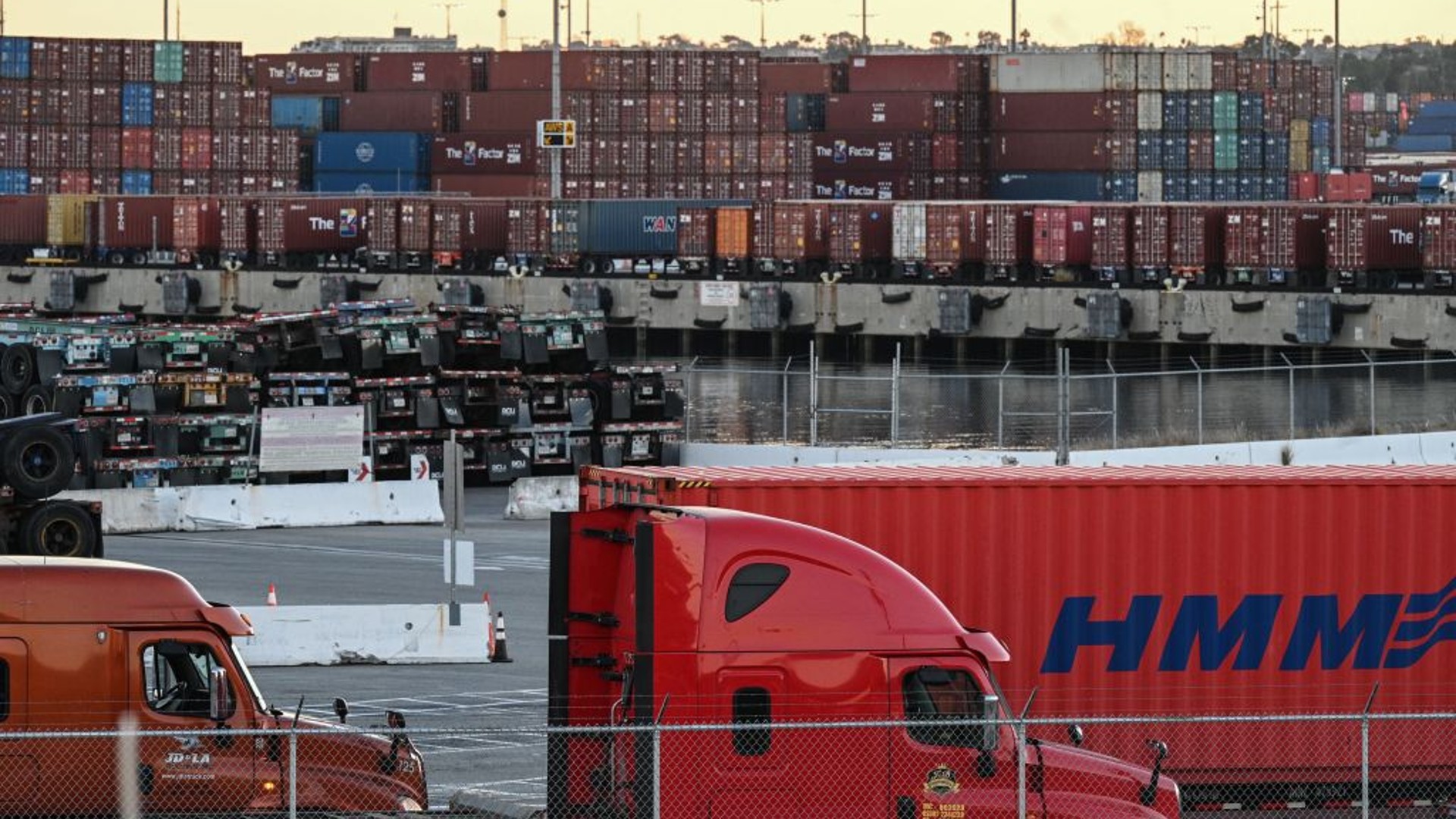 Trucks wait in long, slow-moving lines to collect containers full of products, at the Port of Los Angeles in San Pedro, California, November 11, 2021. (ROBYN BECK/AFP via Getty Images)