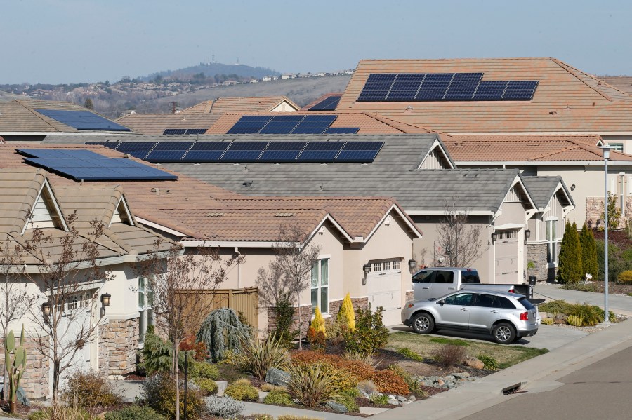 This photo taken Feb. 12, 2020, shows solar panels on rooftops of a housing development in Folsom, Calif. (AP Photo/Rich Pedroncelli, File)