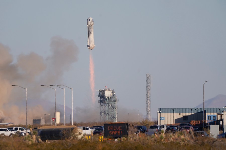 Blue Origin's New Shepard rocket launches carrying TV celebrity and former NFL football great Michael Strahan along with other passengers from its spaceport near Van Horn, Texas, Saturday, Dec. 11, 2021. Joining Strahan on the short space flight are Laura Shepard Churchley, the oldest daughter of America's first astronaut, Alan Shepard, as well as four paying customers. (AP Photo/LM Otero)