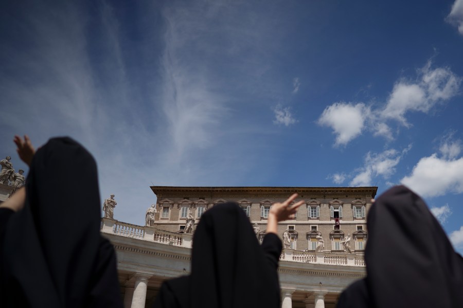 Nuns wave as Pope Francis delivers his blessing from the window of his studio overlooking St.Peter's Square, at the Vatican, on June 7, 2020. Pope Francis on Saturday, Dec. 11, 2021 drew attention to a taboo problem that the Vatican has long ignored or downplayed: the abuses of power by mother superiors against nuns who, because of their vows of obedience, have little recourse but to obey. (AP Photo/Andrew Medichini)