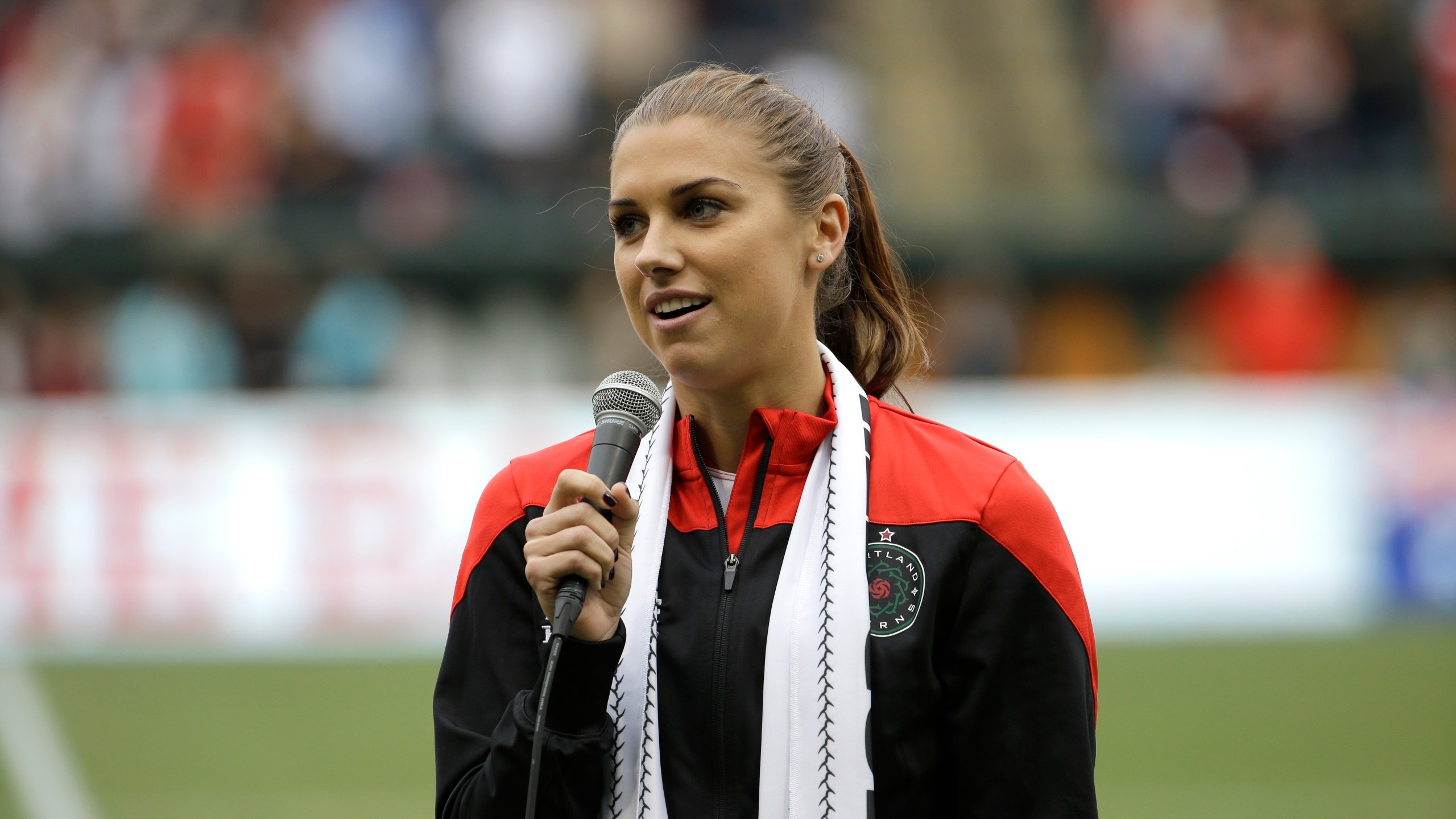 Portland Thorns forward Alex Morgan speaks to the crowd before their NWSL soccer match against the Seattle Reign in Portland, Ore., July 22, 2015. (AP Photo/Don Ryan, file)