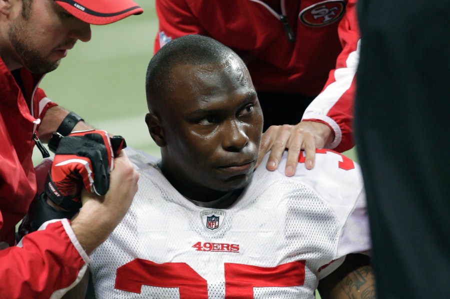 In this Dec. 26, 2010, file photo, San Francisco 49ers cornerback Phillip Adams (35) is attended to after injuring his left leg during the third quarter of an NFL football game against the St. Louis Rams, in St. Louis. On Tuesday, Dec. 14, 2021, a coroner is set to release the results of a brain test for chronic traumatic encephalopathy on former NFL player Adams, who was accused of fatally shooting six people in Rock Hill, South Carolina, before killing himself in April. Adams' family agreed after his death to have his brain tested for the degenerative disease linked to head trauma and concussions. (AP Photo/Tom Gannam, File)