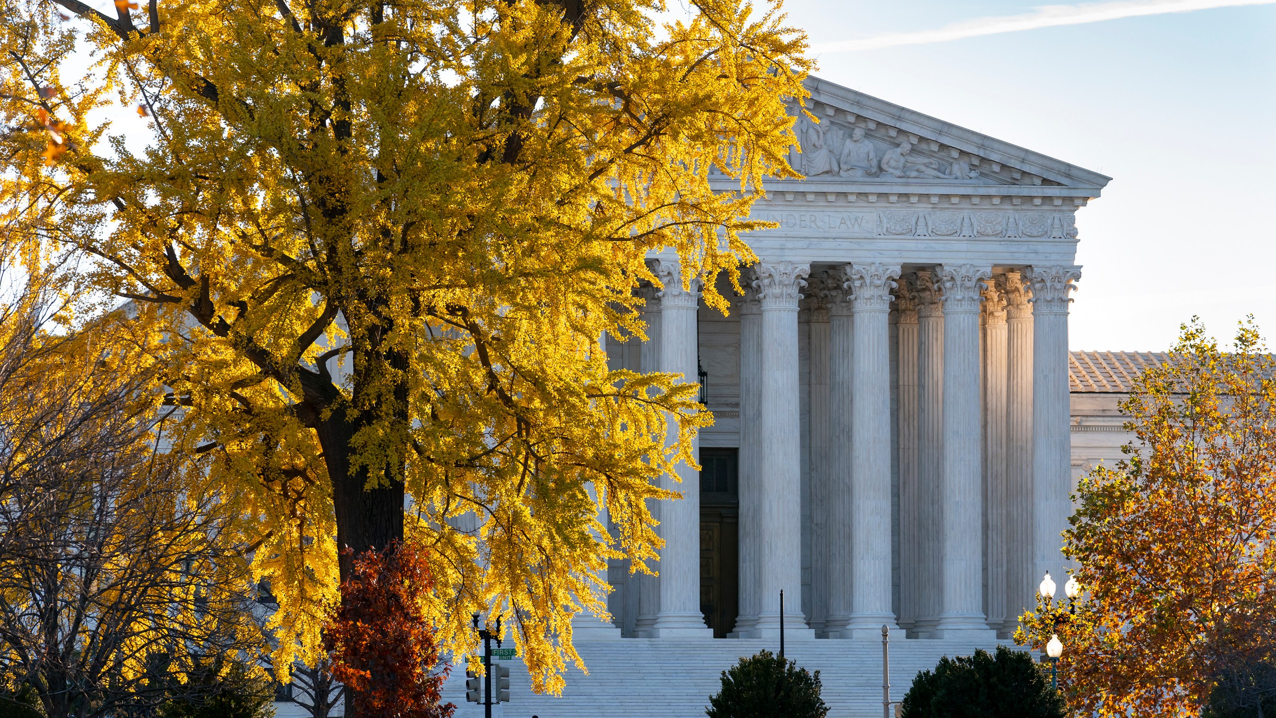 Light from the morning sun illuminates the Supreme Court on Friday, Dec. 3, 2021. (J. Scott Applewhite/Associated Press)