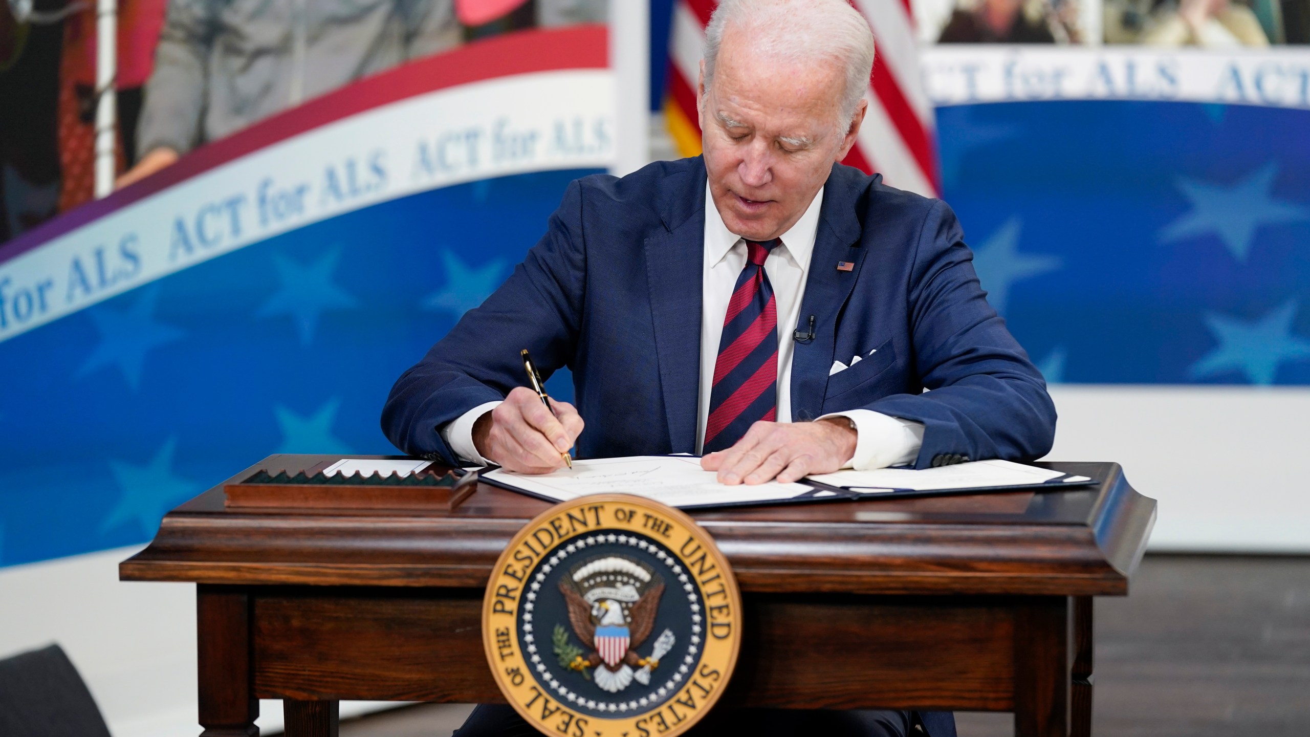 President Joe Biden is seen in the South Court Auditorium on the White House campus in Washington, Thursday, Dec. 23, 2021. (AP Photo/Patrick Semansky)