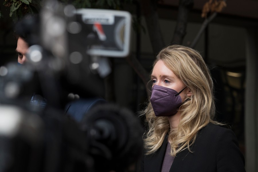 Former Theranos CEO Elizabeth Holmes leaves federal court in San Jose, Calif. on Dec. 23, 2021. (AP Photo/Nic Coury)