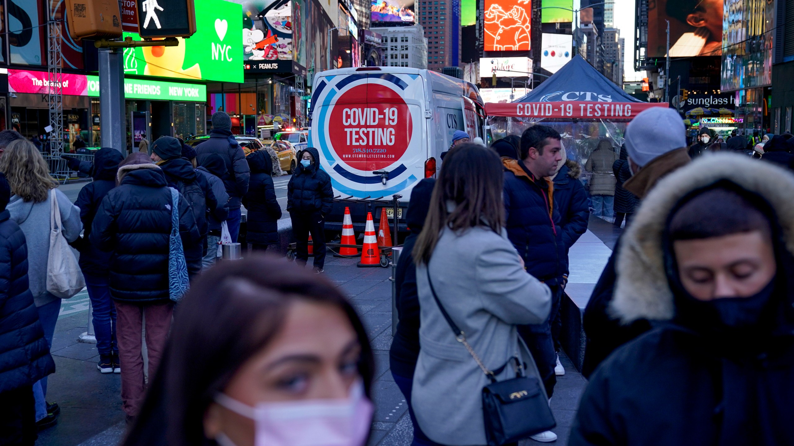 People wait in a long line to get tested for COVID-19 in Times Square, New York, on Dec. 20, 2021. (AP Photo/Seth Wenig, file)