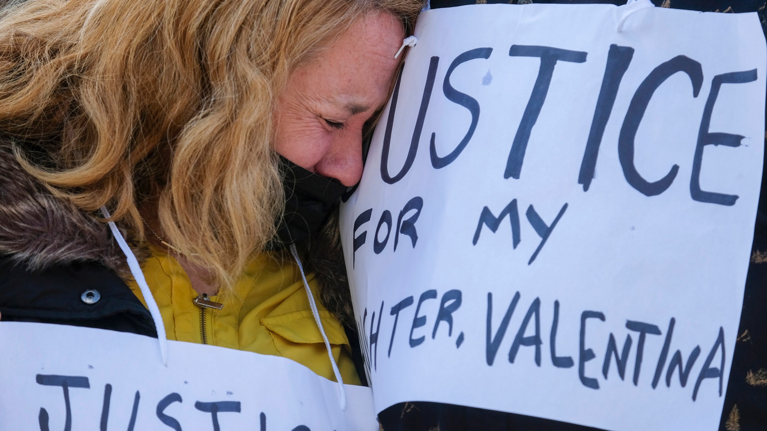 Soledad Peralta, mother of Valentina Orellana-Peralta, cries at a news conference outside Los Angeles Police Department Headquarters in Los Angeles, Tuesday, Dec. 28, 2021. The parents of Valentina Orellana-Peralta -- the 14-year-old girl killed by a stray bullet fired by an LAPD officer at a North Hollywood clothing store last week, and their attorneys held a news conference to discuss the family's demand for transparency from the Los Angeles Police Department. (AP Photo/Ringo H.W. Chiu)