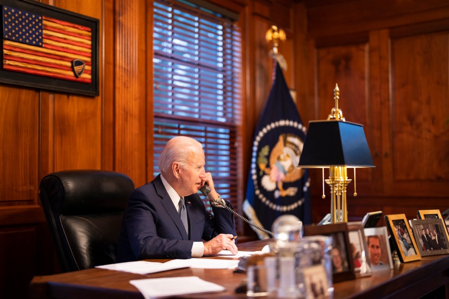 In this image provided by The White House, President Joe Biden speaks with Russian President Vladimir Putin on the phone from his private residence in Wilmington, Del., on Dec. 30, 2021. (Adam Schultz/The White House via AP)