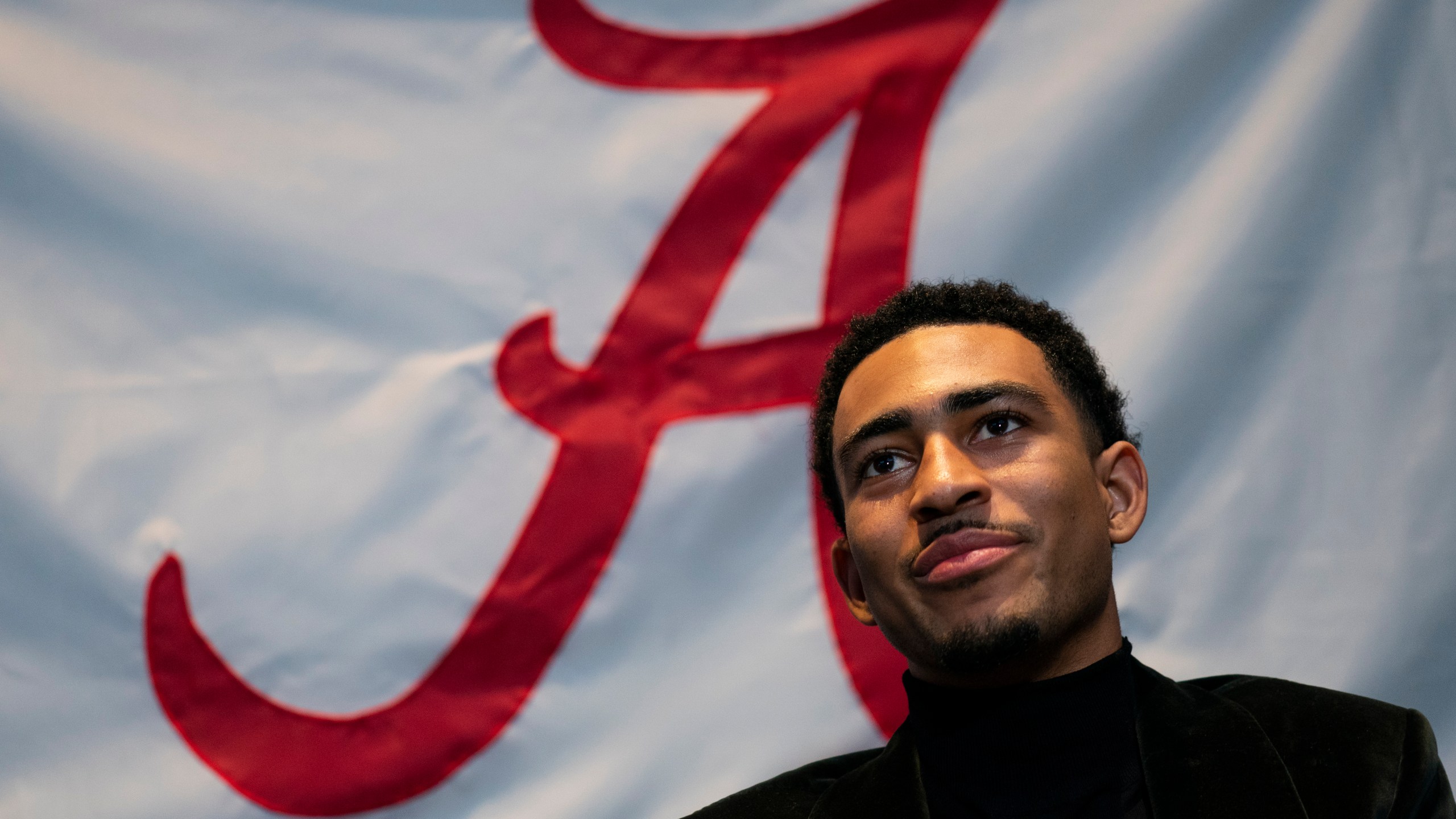 Heisman Trophy finalist Alabama quarterback Bryce Young speaks with members of the media before attending the Heisman Trophy award ceremony, Saturday, Dec. 11, 2021, in New York. (AP Photo/John Minchillo)