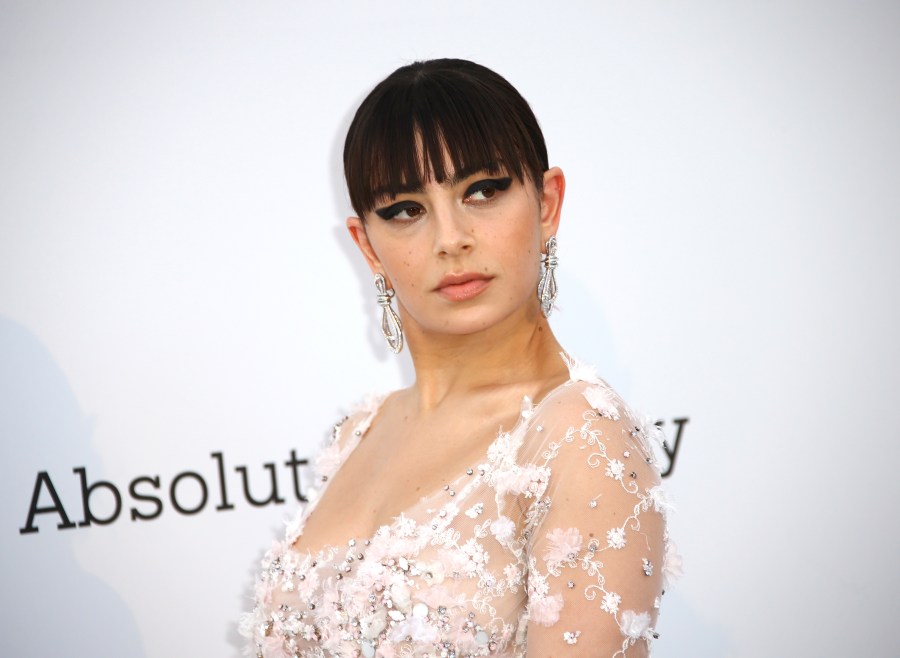 Charli XCX poses for photographers upon arrival at the amfAR, Cinema Against AIDS, benefit at the Hotel du Cap-Eden-Roc, during the 72nd international Cannes film festival, in Cap d'Antibes, southern France, Thursday, May 23, 2019. The singer was scheduled to be the night’s musical guest on “Saturday Night Live,” but bowed out Saturday afternoon, Dec. 18, 2021, citing the limited crew for the taping. The long-running sketch comedy show announced on social media Saturday afternoon that the night’s episode would tape without a live audience and with only limited cast and crew as a precaution against the Omicron variant. (Photo by Joel C Ryan/Invision/AP, File)