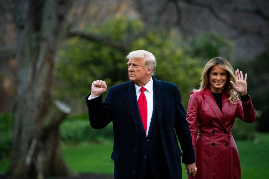 Donald Trump pumps his fist and Trump waves as they depart on the South Lawn of the White House, on December 5, 2020 in Washington, DC. (Al Drago/Getty Images)