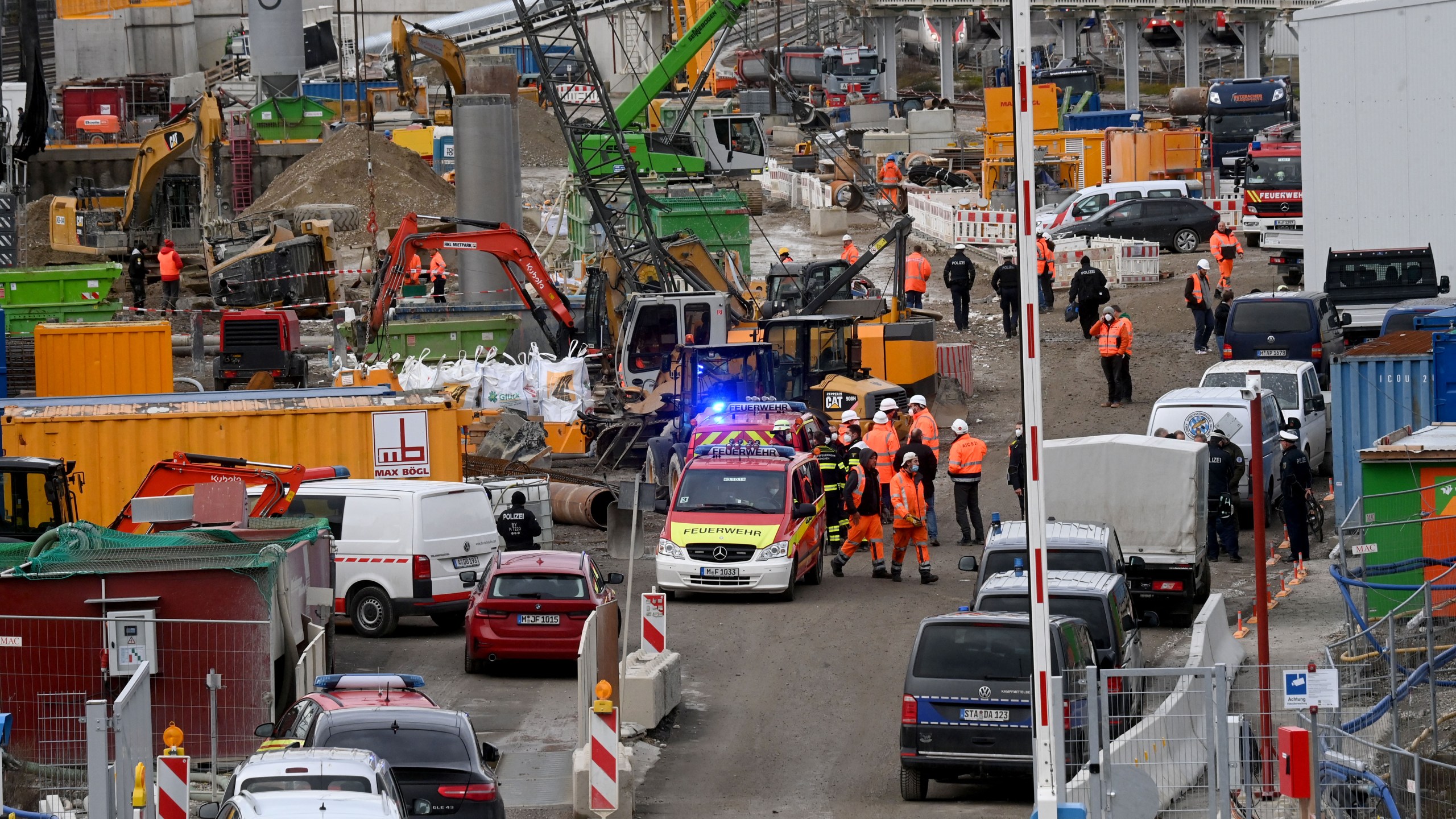 Fire brigades and policemen work at the site of a bomb explosion close to the main railway station in Munich, southern Germany, on December 1, 2021. - According to media reports, four persons were injured, one of them seriously, when a Word War II bomb exploded as works were under way at a construction site close to the railway station. (Photo by CHRISTOF STACHE / AFP) (Photo by CHRISTOF STACHE/AFP via Getty Images)