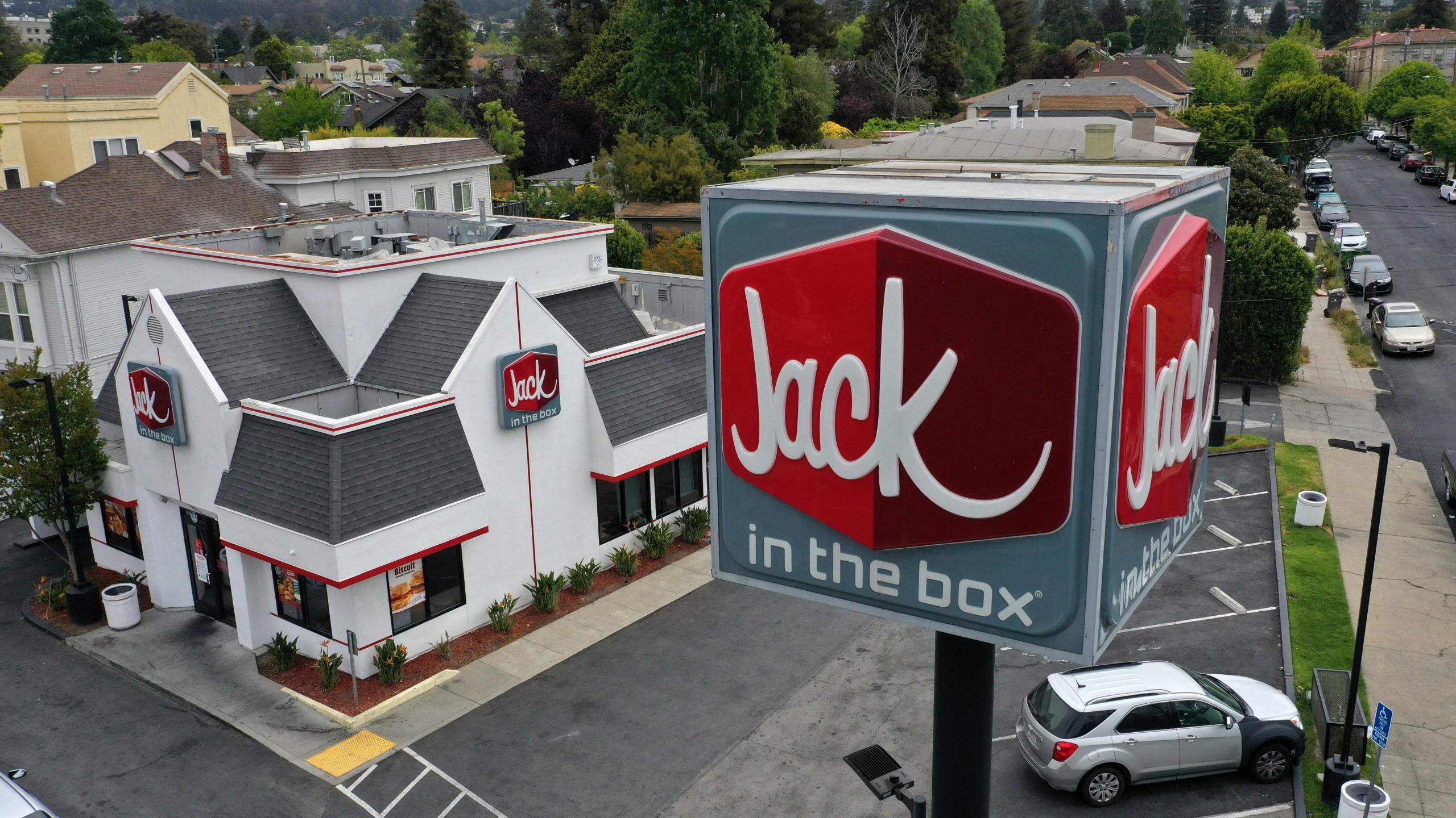 In an aerial view, a sign is posted in front of a Jack in the Box restaurant on May 12, 2021 in Berkeley. Justin Sullivan/Getty Images)