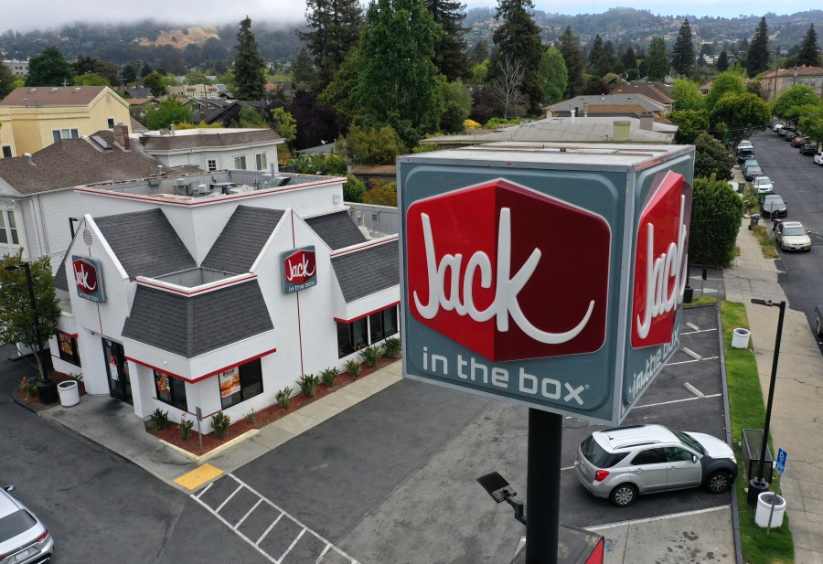 In an aerial view, a sign is posted in front of a Jack in the Box restaurant on May 12, 2021 in Berkeley. Justin Sullivan/Getty Images)