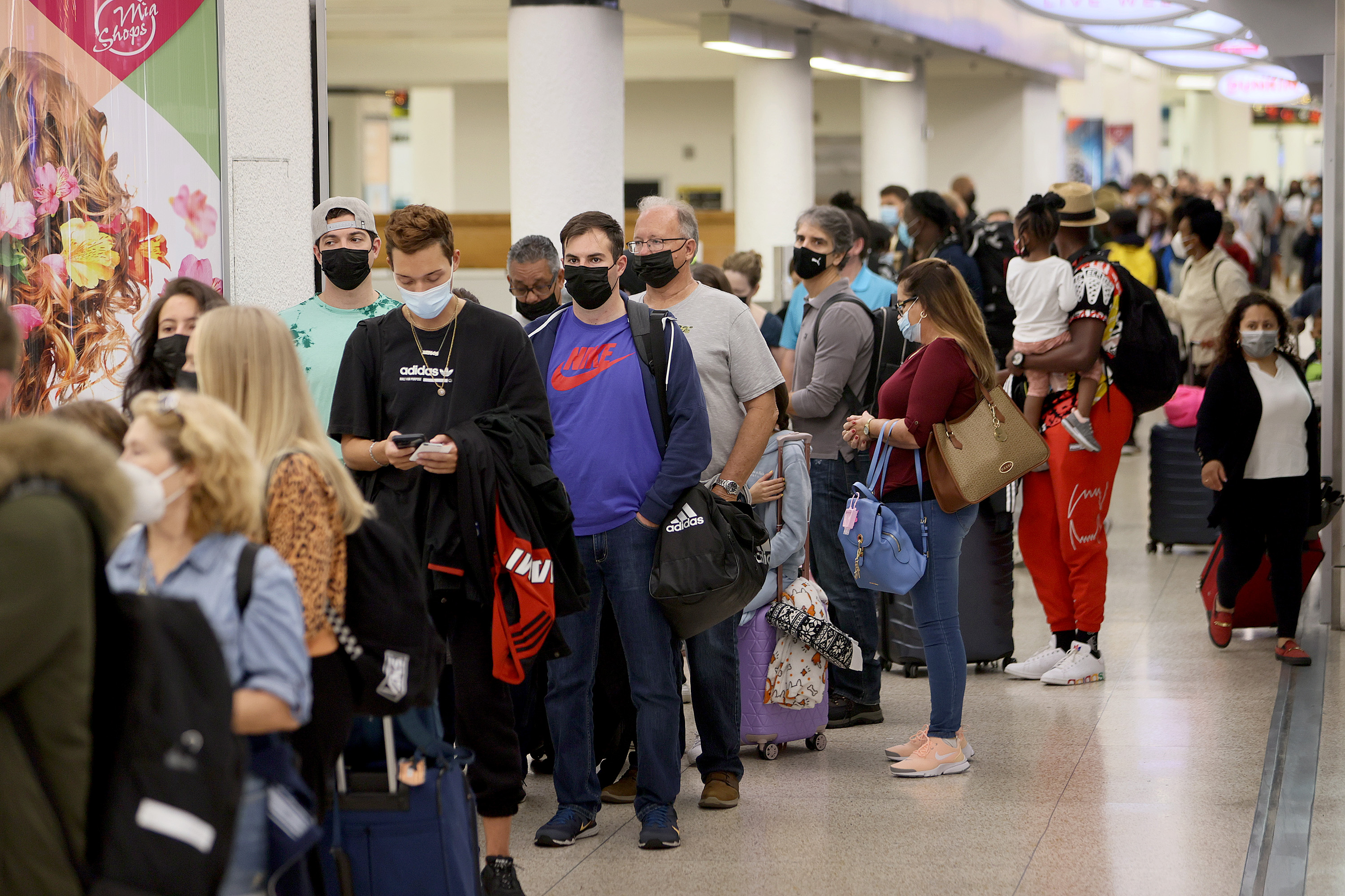 People wait in the line to clear through the TSA checkpoint at Miami International Airport on Nov. 24, 2021, in Miami, Florida. (Joe Raedle/Getty Images)