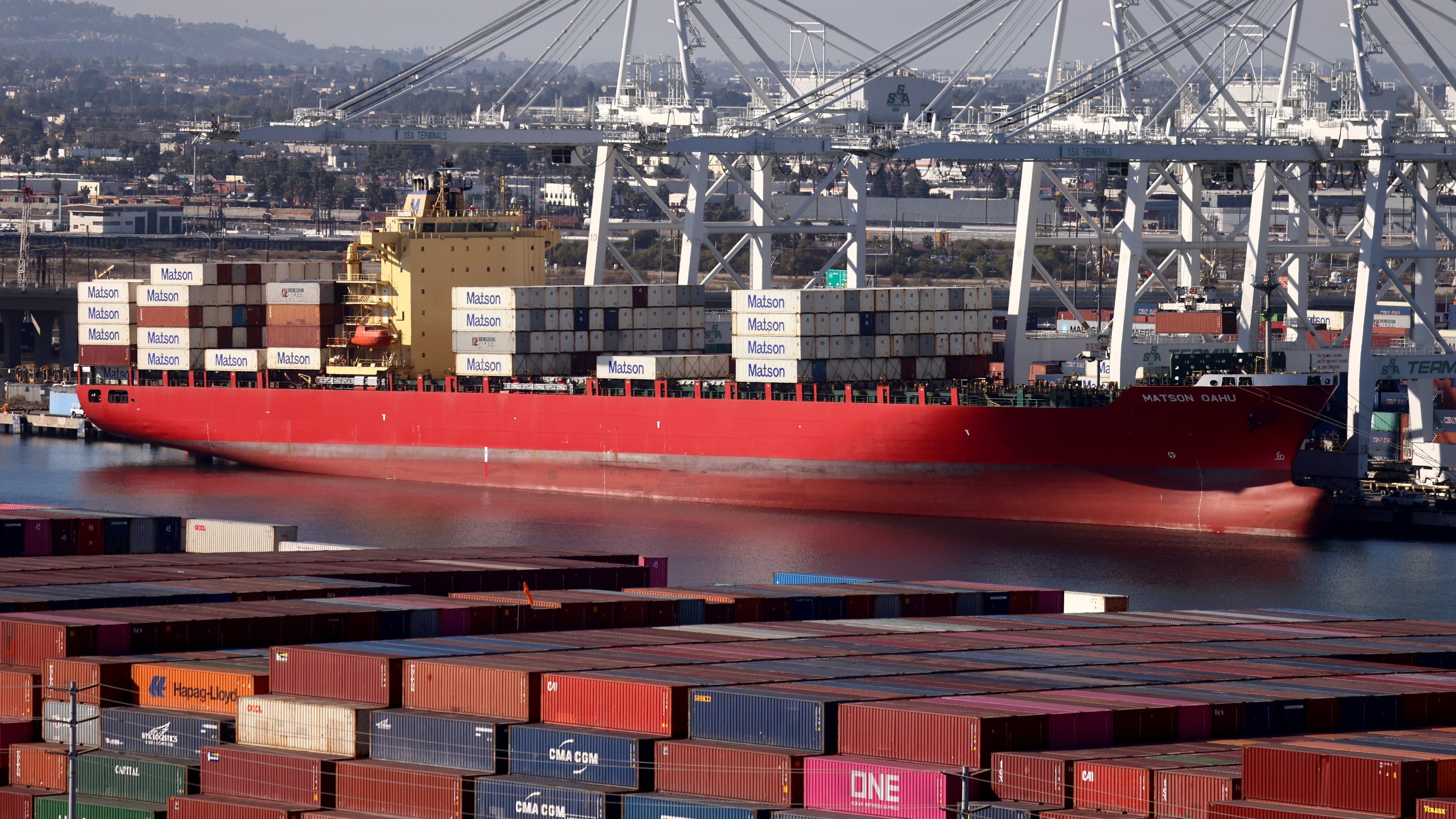 Shipping containers are stacked on the Matson Oahu container ship at the Port of Long Beach on Nov. 24, 2021 in Long Beach. (Mario Tama/Getty Images)