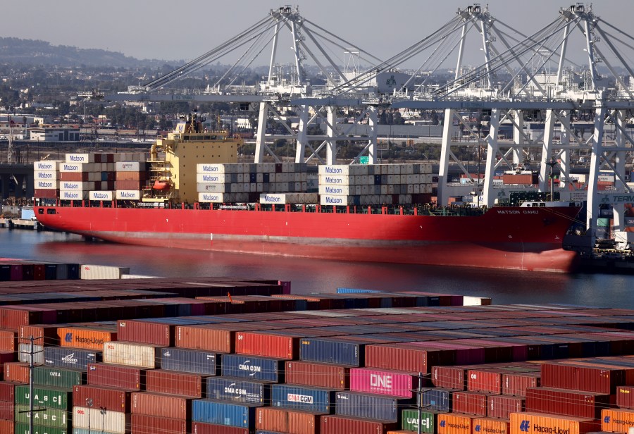 Shipping containers are stacked on the Matson Oahu container ship at the Port of Long Beach on Nov. 24, 2021 in Long Beach. (Mario Tama/Getty Images)