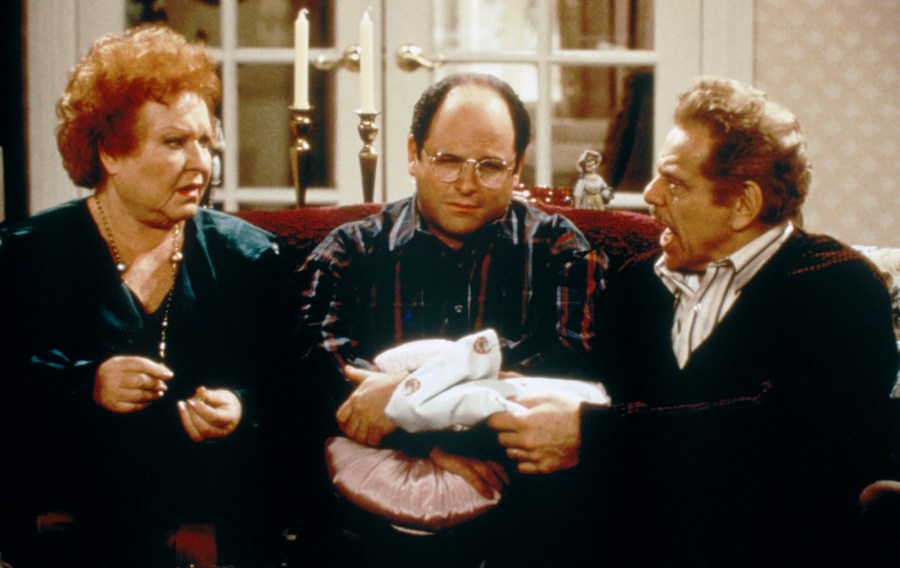 SEINFELD -- "The Shower Head" Episode 15 -- Pictured: (l-r) Estelle Harris as Estelle Costanza, Jason Alexander as George Costanza, Jerry Stiller as Frank Costanza (Photo by Margaret Norton/NBCU Photo Bank/NBCUniversal via Getty Images via Getty Images)