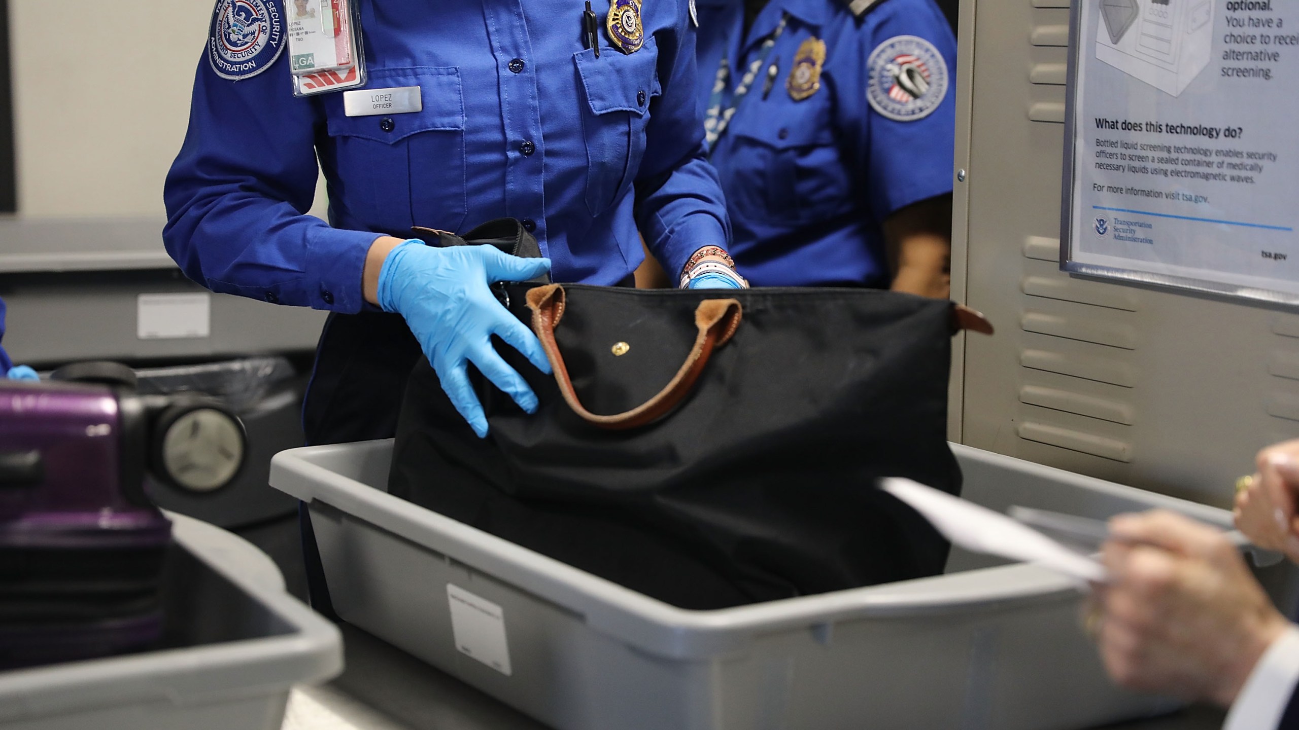 A Transportation Security Administration (TSA) worker screens luggage at LaGuardia Airport (LGA) on Sept. 26, 2017 in New York City. (Spencer Platt/Getty Images)