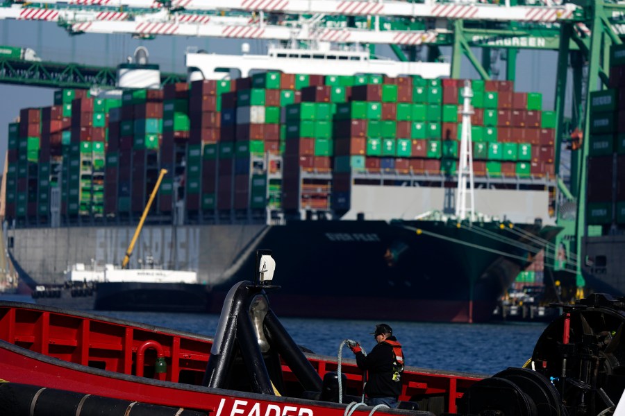 A worker is seen in a tug boat at the Port of Los Angeles on Nov. 10, 2021, in Los Angeles. The Port of Los Angeles is on track to move a record volume of import cargo this year. Officials at the nation's busiest port expect to hit the new mark, even as they struggle to clear a backup of ship traffic and ease supply chain snarls that have been blamed for product shortages and higher shelf prices. (AP Photo/Marcio Jose Sanchez, File)