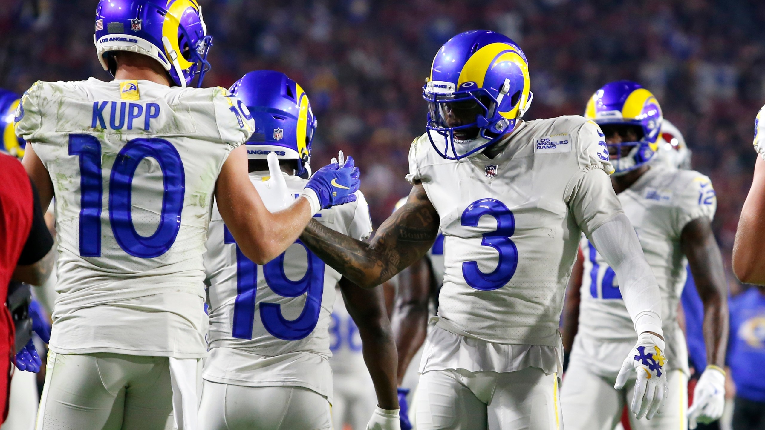 Los Angeles Rams wide receiver Cooper Kupp (10) celebrates his touchdown catch against the Arizona Cardinals with wide receiver Odell Beckham Jr. (3) during the second half of an NFL football game Monday, Dec. 13, 2021, in Glendale, Ariz. (AP Photo/Ralph Freso)