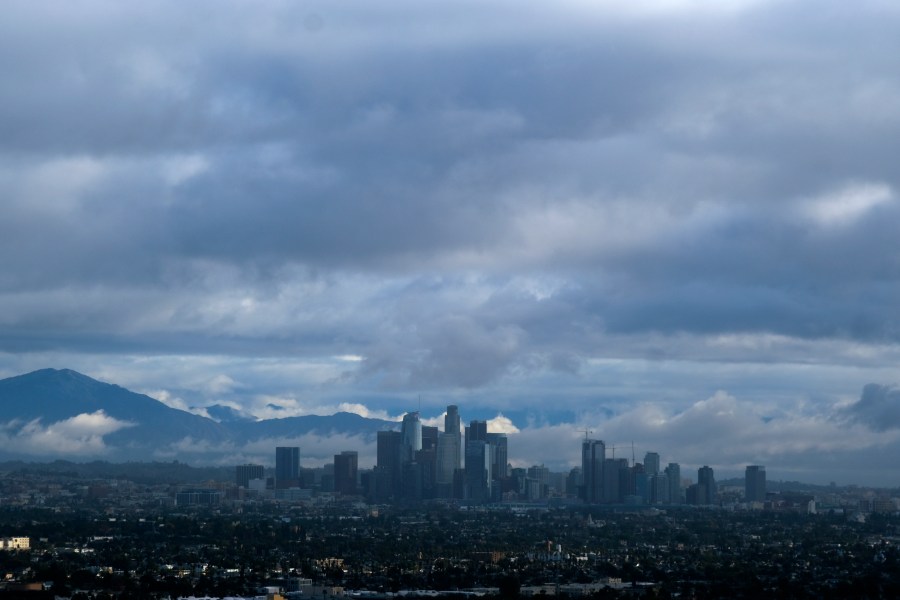 Storm clouds blanket the Los Angeles skyline is seen from Kenneth Hahn State Recreation Area on Dec. 24, 2021. (Ringo H.W. Chiu/Associated Press)