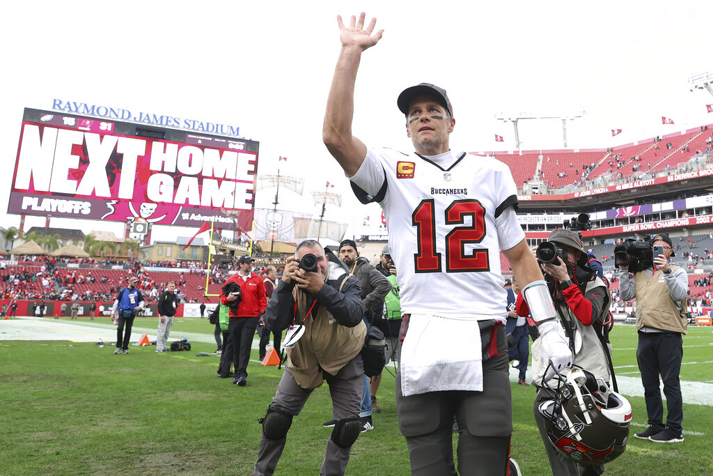 Tampa Bay Buccaneers quarterback Tom Brady (12) waves to the fans after the team defeated the Philadelphia Eagles during an NFL wild-card football game Sunday, Jan. 16, 2022, in Tampa, Fla. (AP Photo/Mark LoMoglio)