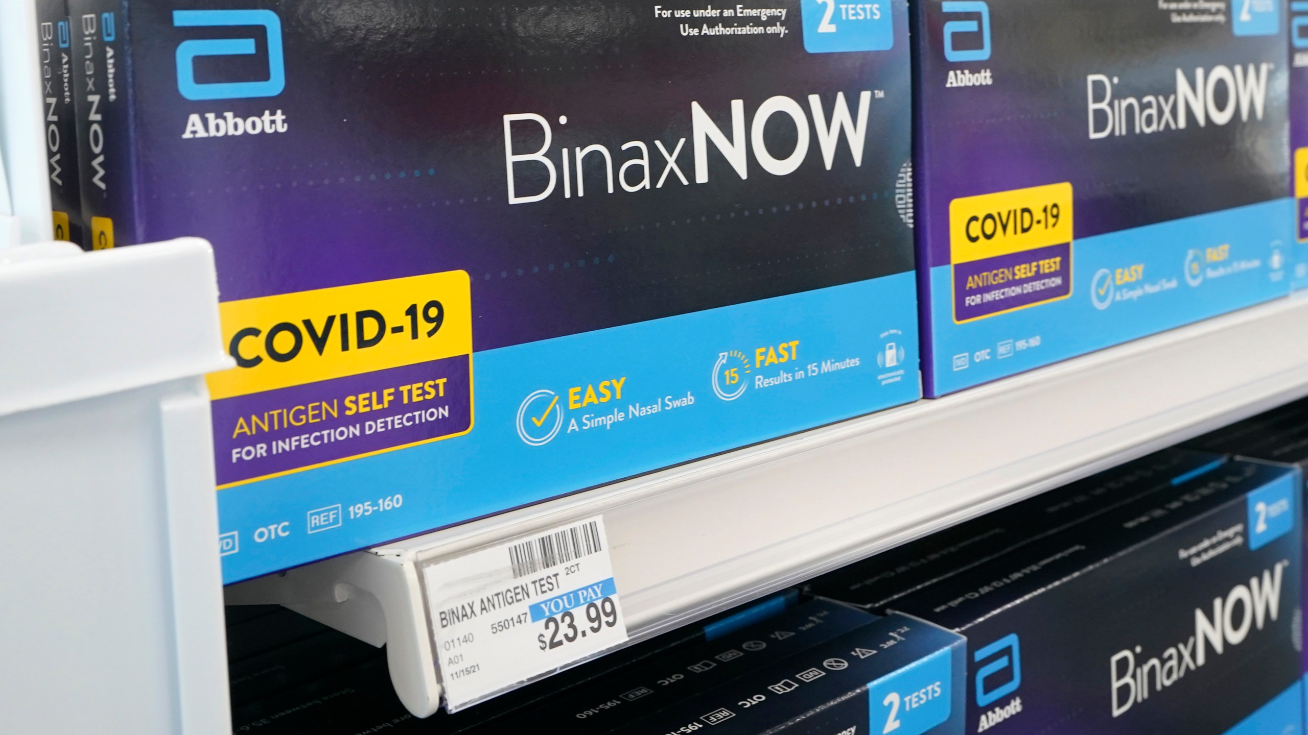 Boxes of BinaxNow home COVID-19 tests made by Abbott are shown for sale Monday, Nov. 15, 2021, at a CVS store in Lakewood, Wash.(AP Photo/Ted S. Warren)