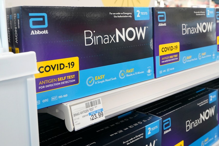 Boxes of BinaxNow home COVID-19 tests made by Abbott are shown for sale Monday, Nov. 15, 2021, at a CVS store in Lakewood, Wash.(AP Photo/Ted S. Warren)